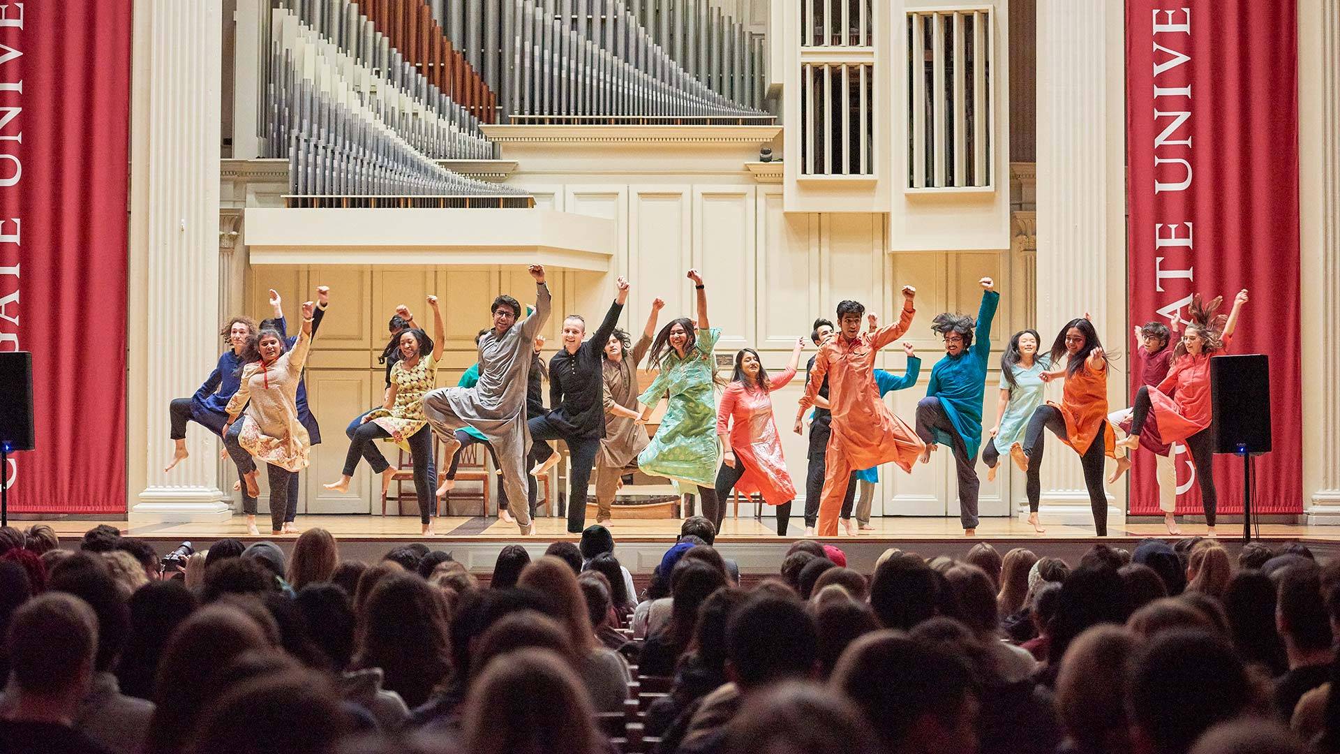 Students dance at Dancefest on the stage in Memorial Chapel