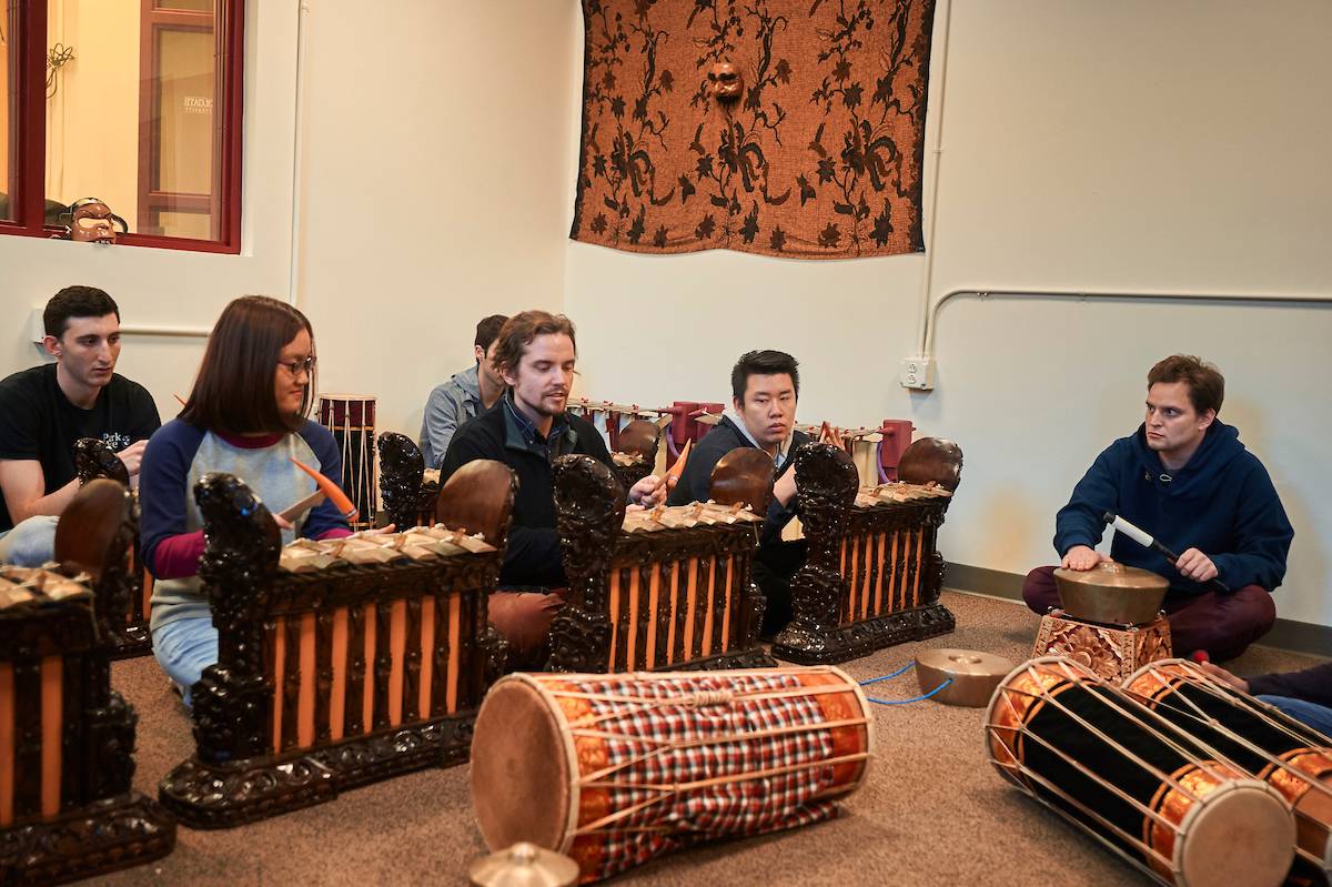 Students perform with gamelan instruments