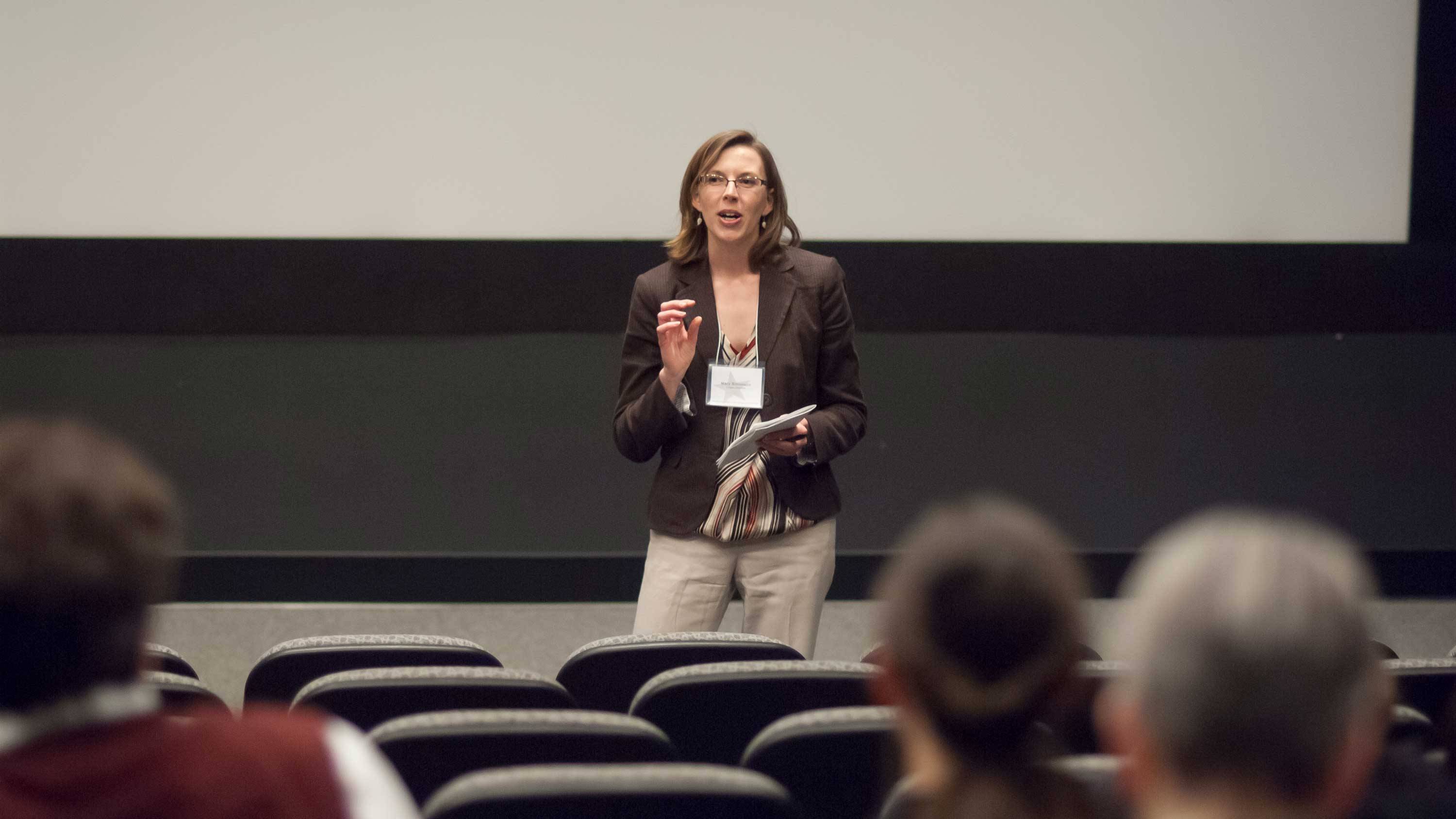 Prof. Mary Simonson in front of audience