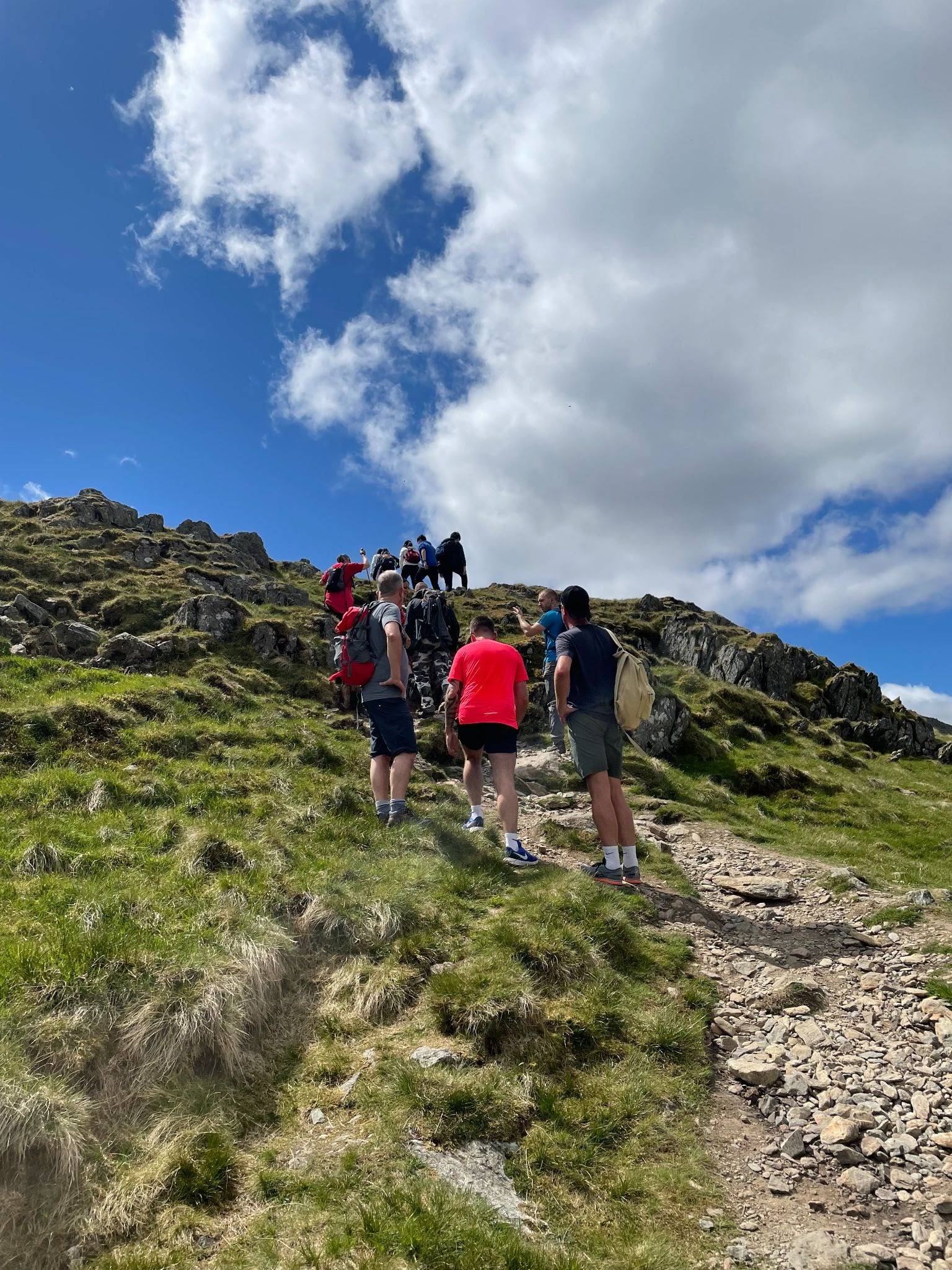Hikers lining up to make their way over a fell in Glenridding, the Lake District. June 6, 2021.