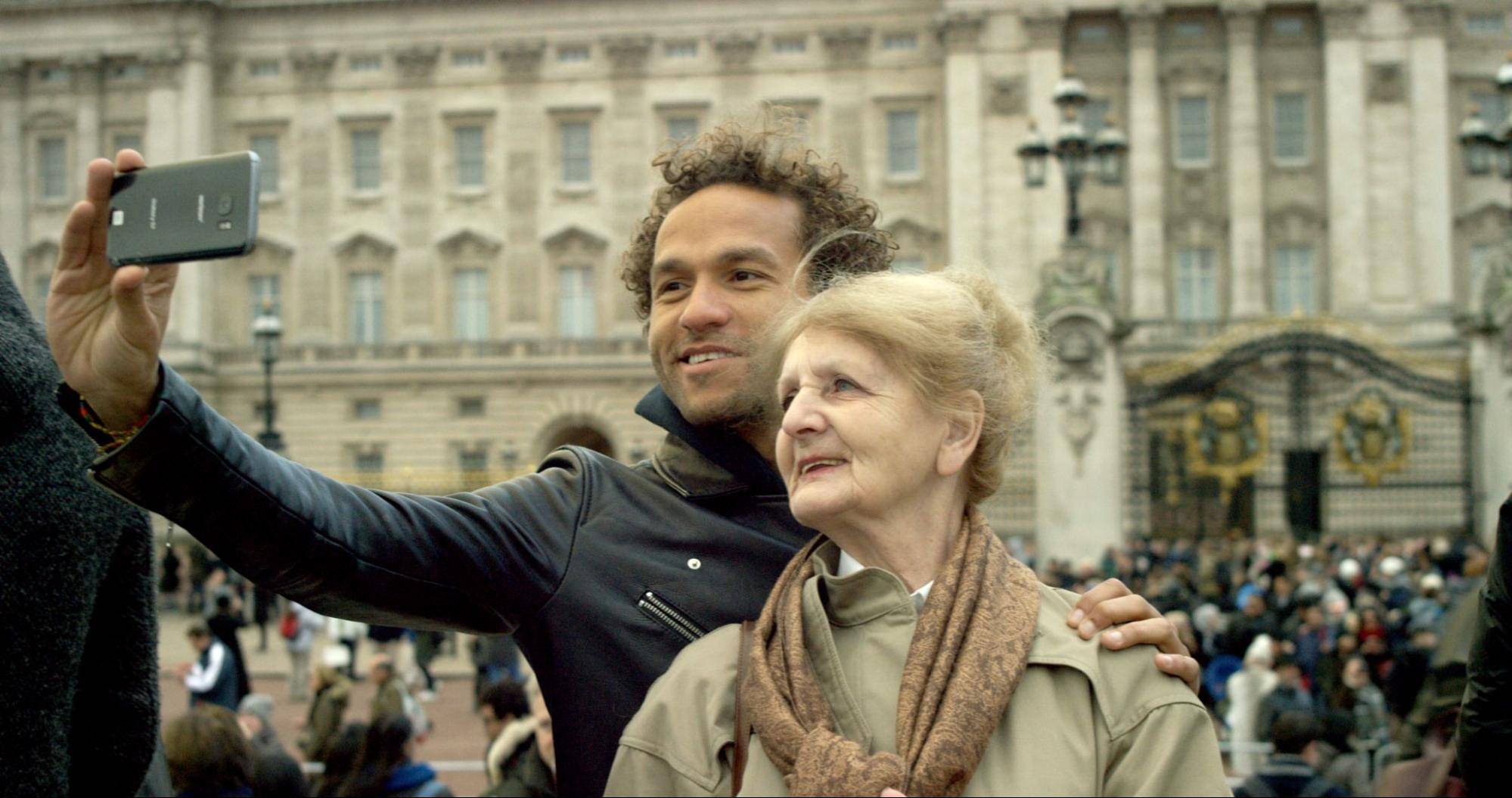 Filmmaker Sian-Pierre Regis taking a photo with his mother