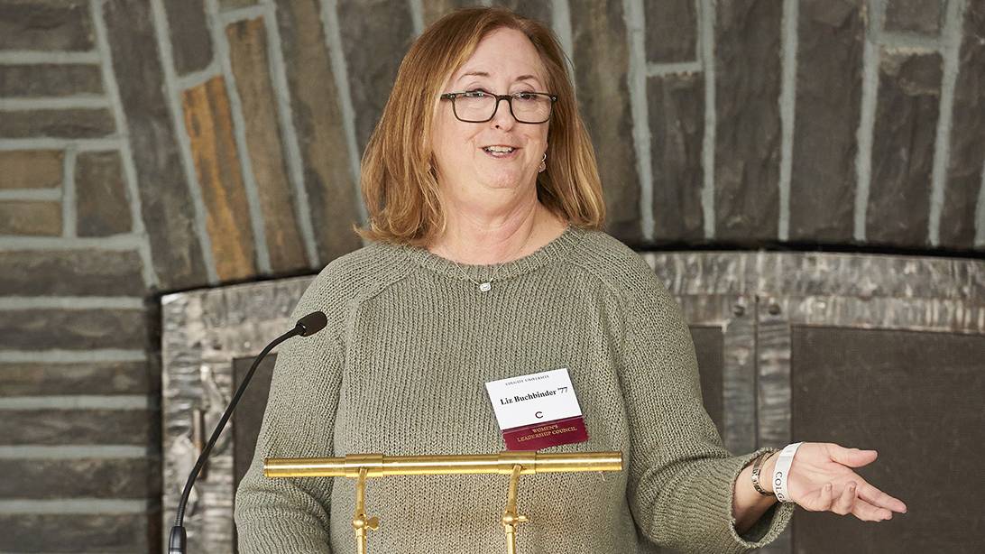 Women's Leadership Council chair Liz Buchbinder announces the 13 Women, $13 Million initiative from a podium at Colgate Charter Day Luncheon.