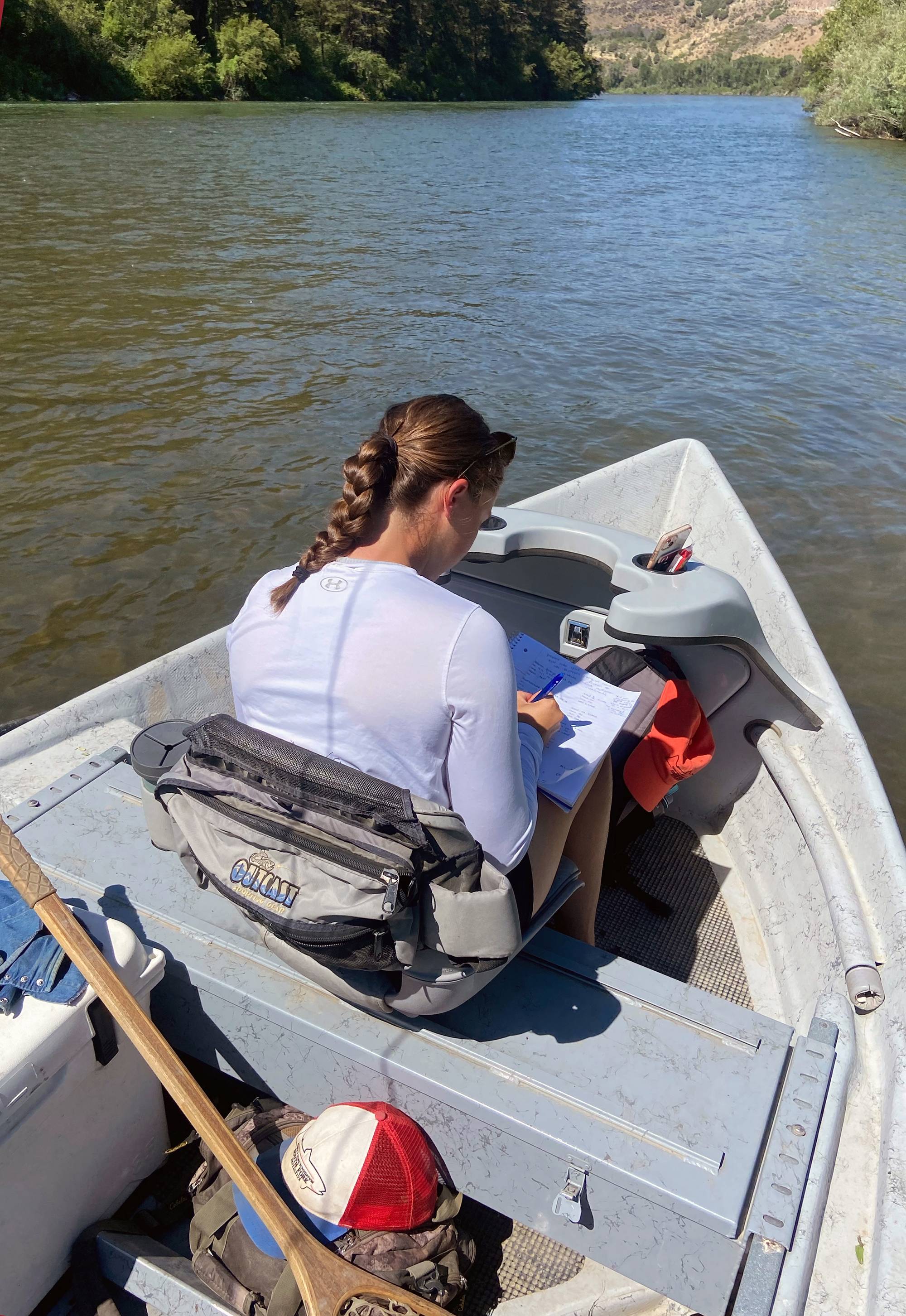 Abigail Lewis ’23 working in a boat