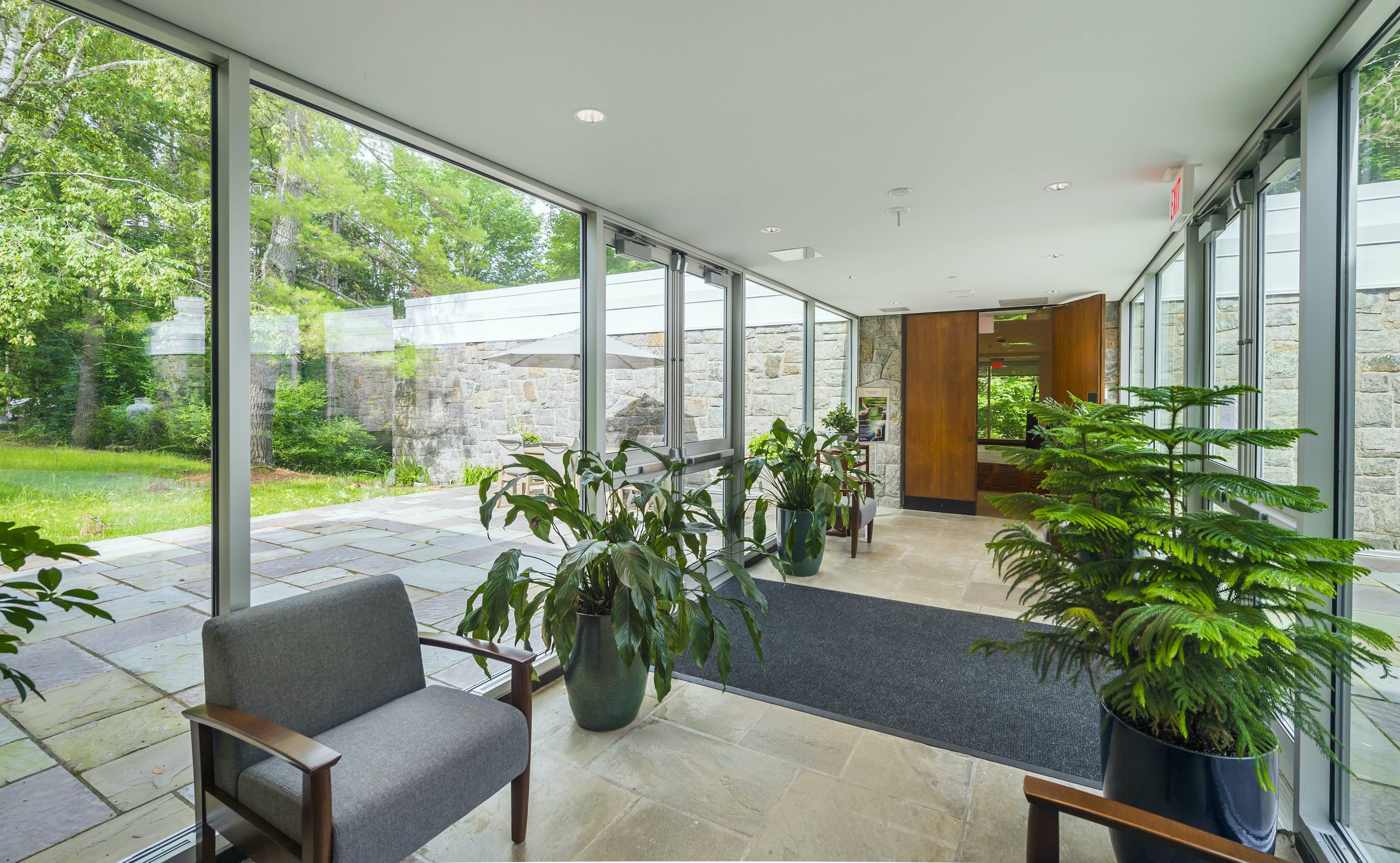 Glass walkway between the house and chapel at Chapel House