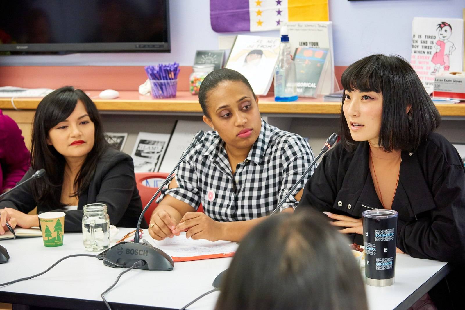 A panel of three people at a Women's Center event