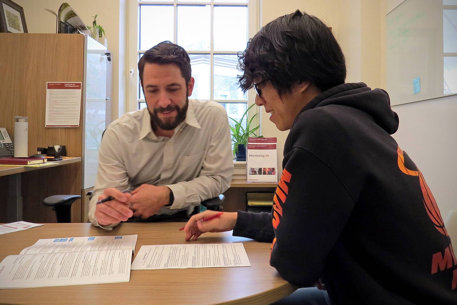 A student works with a career counselor to define their career plan
