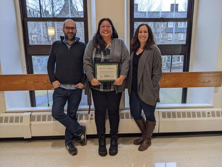 Photo of Nicole Carvell flanked by her two supervisors as she is awarded with the university's first Sustainability Champion award.