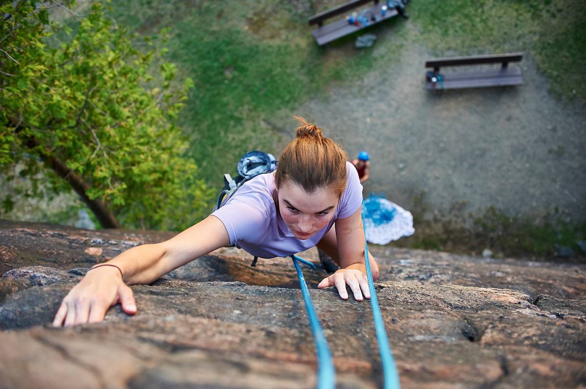 A student rock climbing