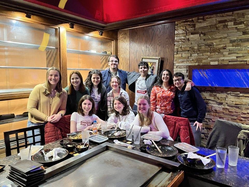 Farrell and the Mantiphondrakes at an a cappella team dinner