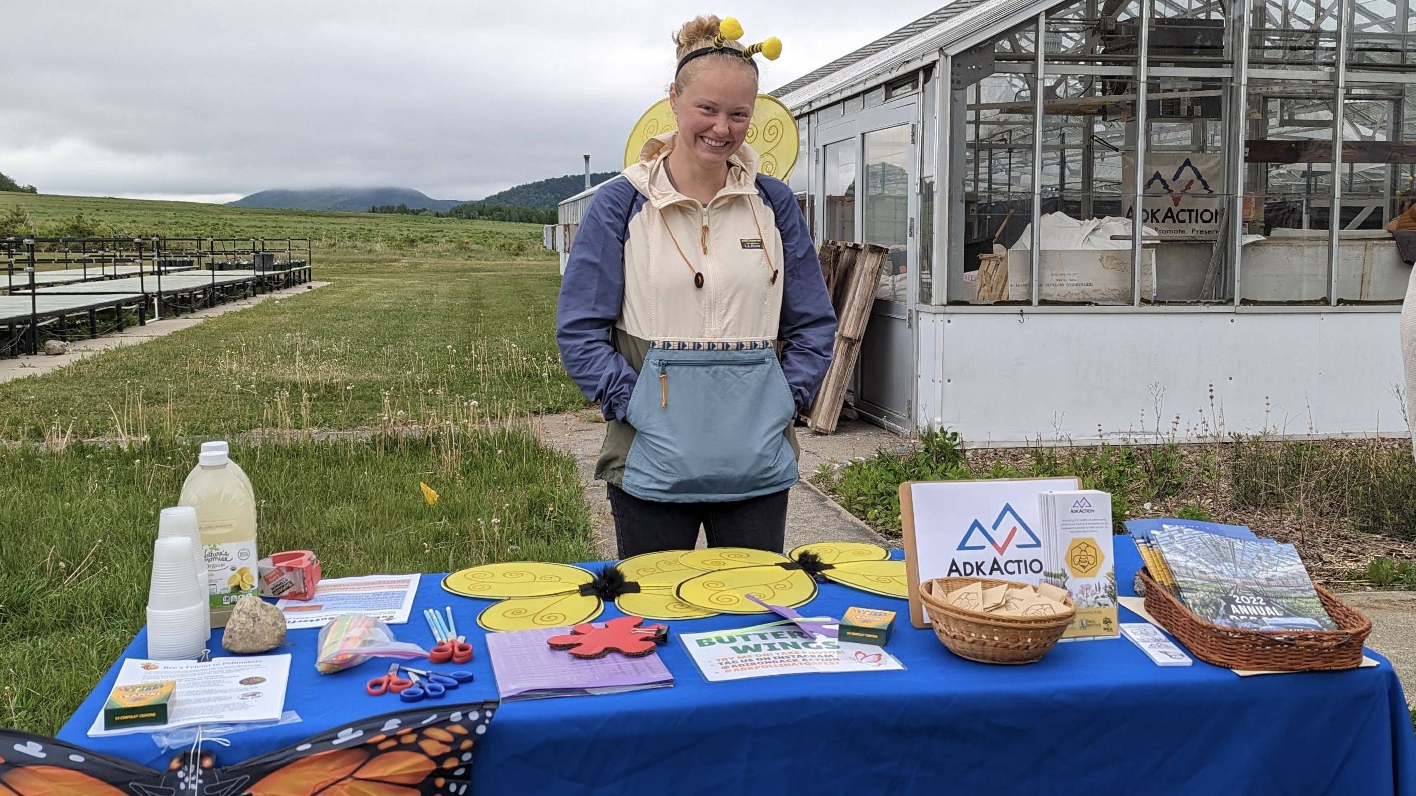 Kayla handing out promotional materials at an AdkAction event