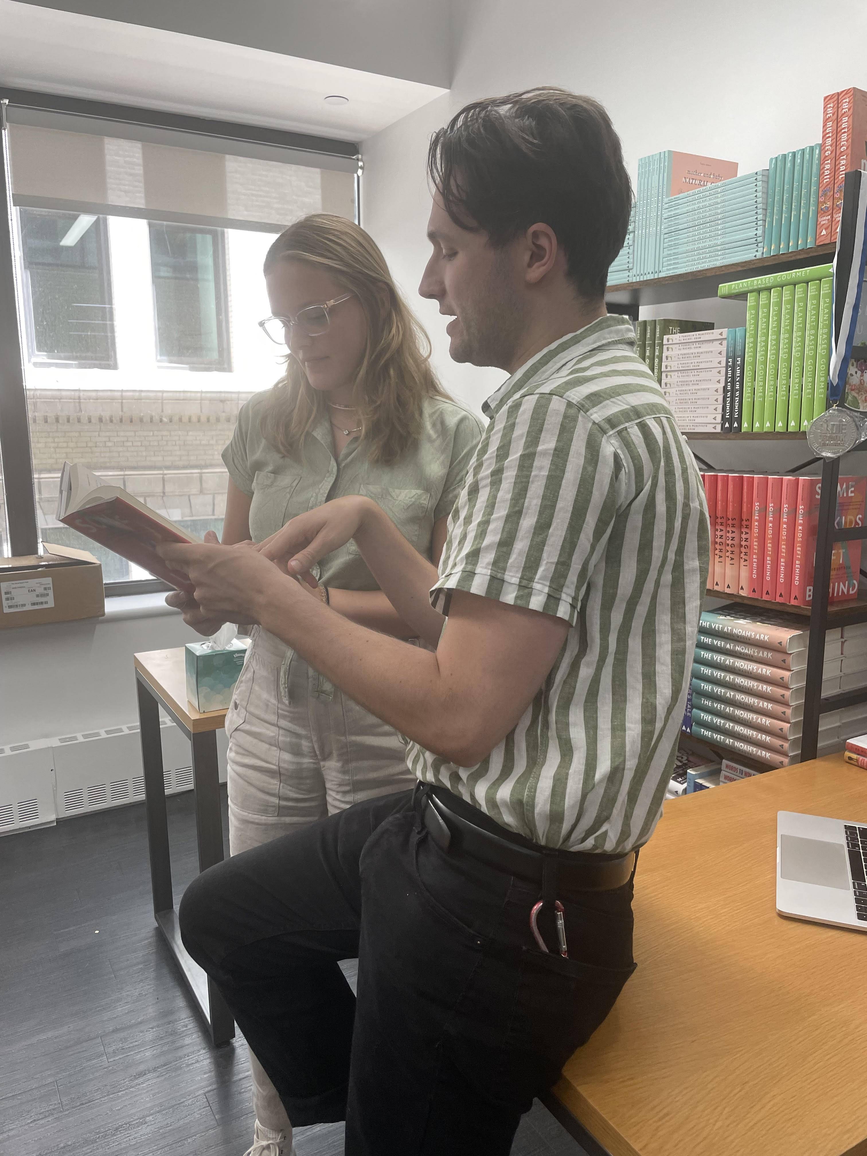 Jesse reviewing one of Apollo’s hardcovers with the associate editor