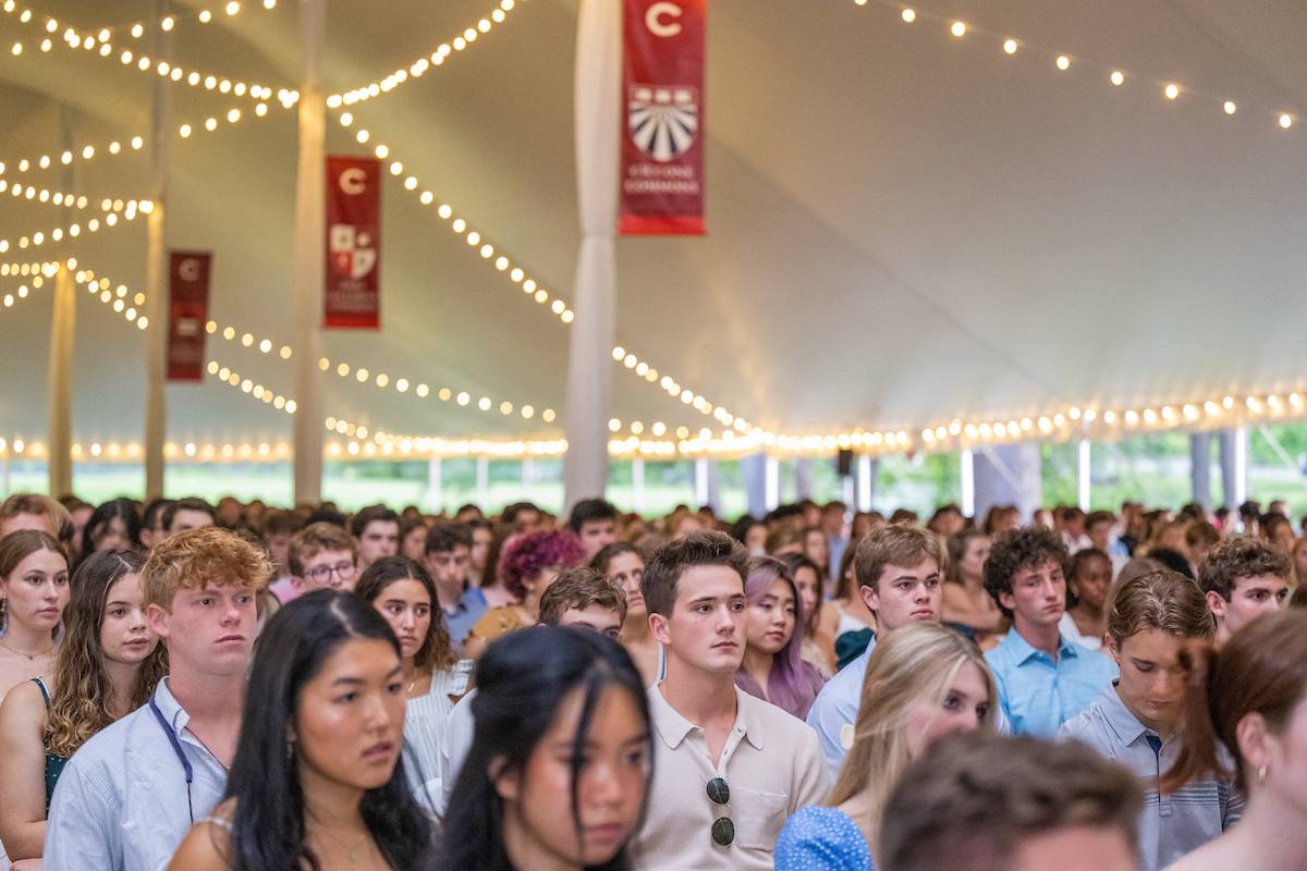 Students gather under tent during Colgate convocation.