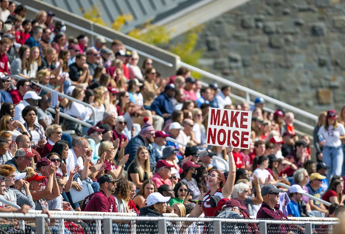 crowd gathers in Colgate football stadium to cheer on team during Homecoming Weekend