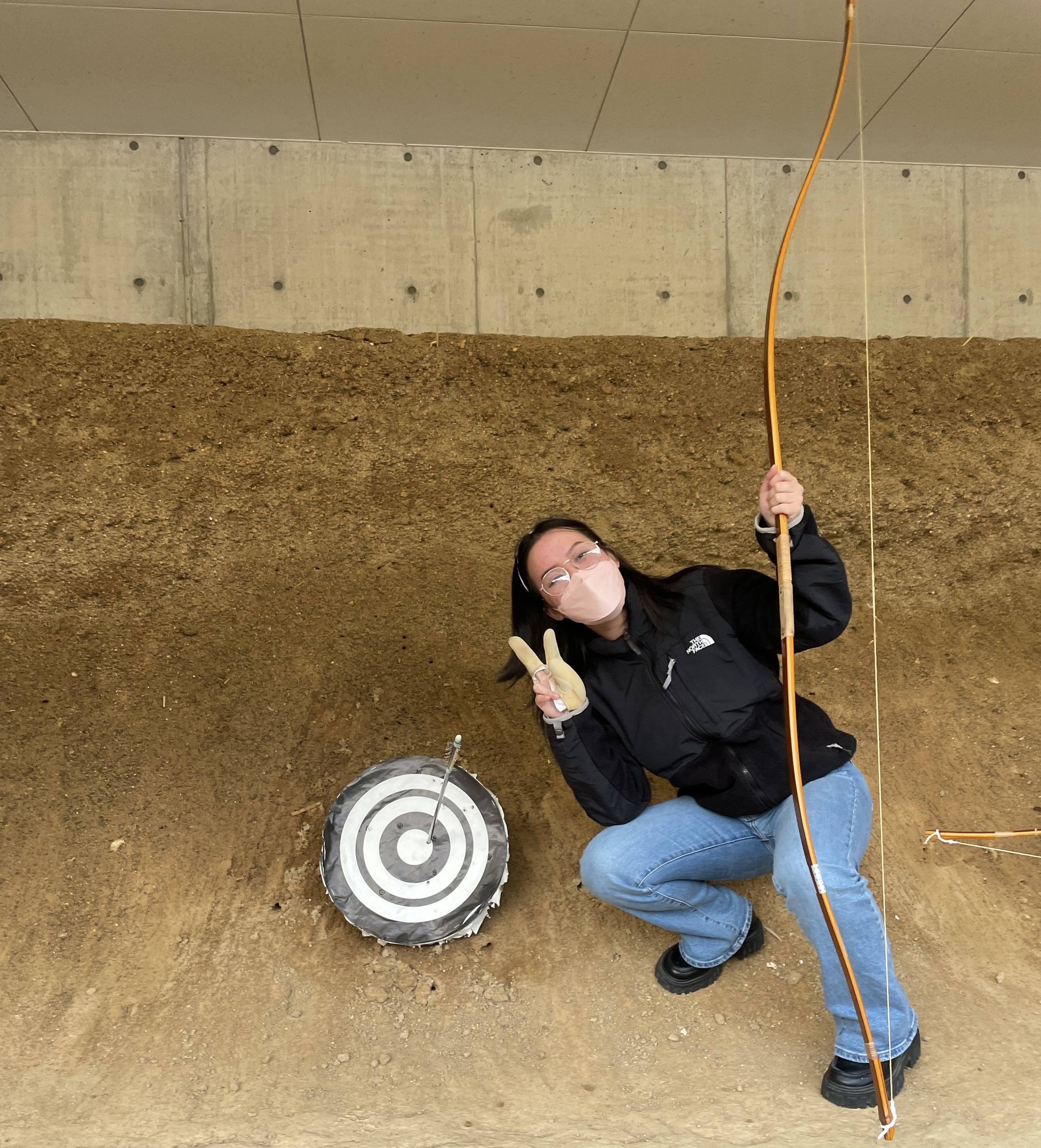 Linh taking full advantage on her study group and practicing Kyudo, Japanese longbow archery