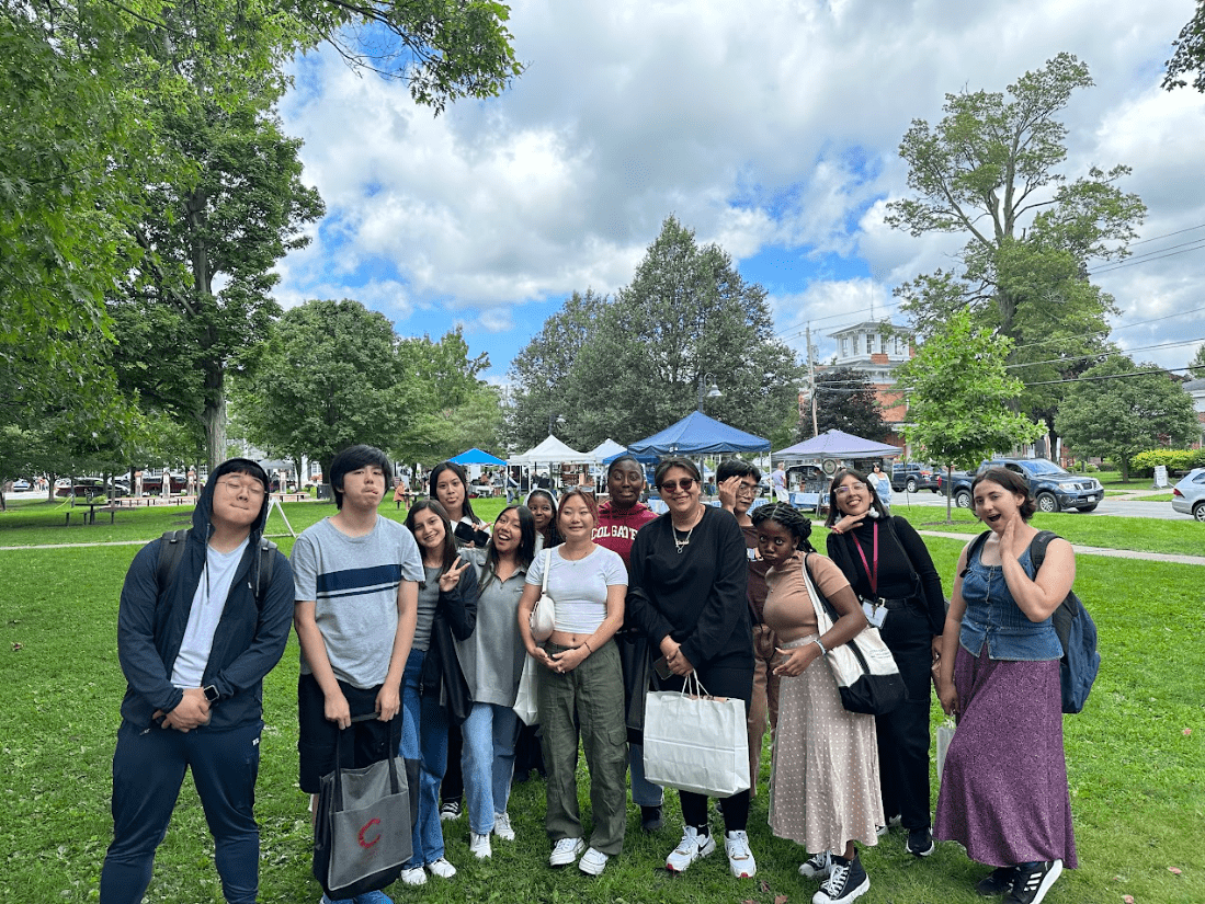 Students posing for a silly photo on the Hamilton Green.