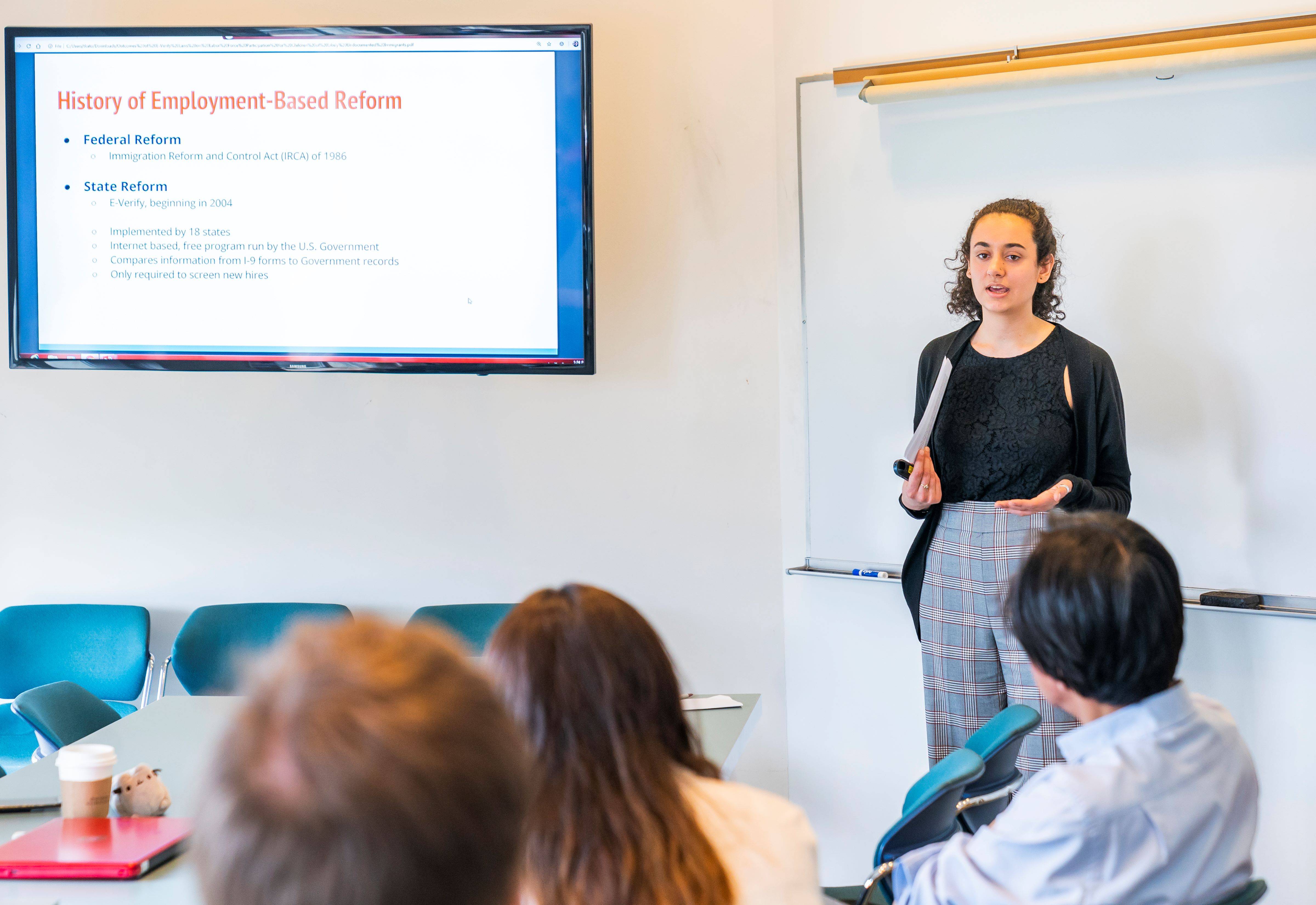 Colgate honor students listen during a thesis presentation
