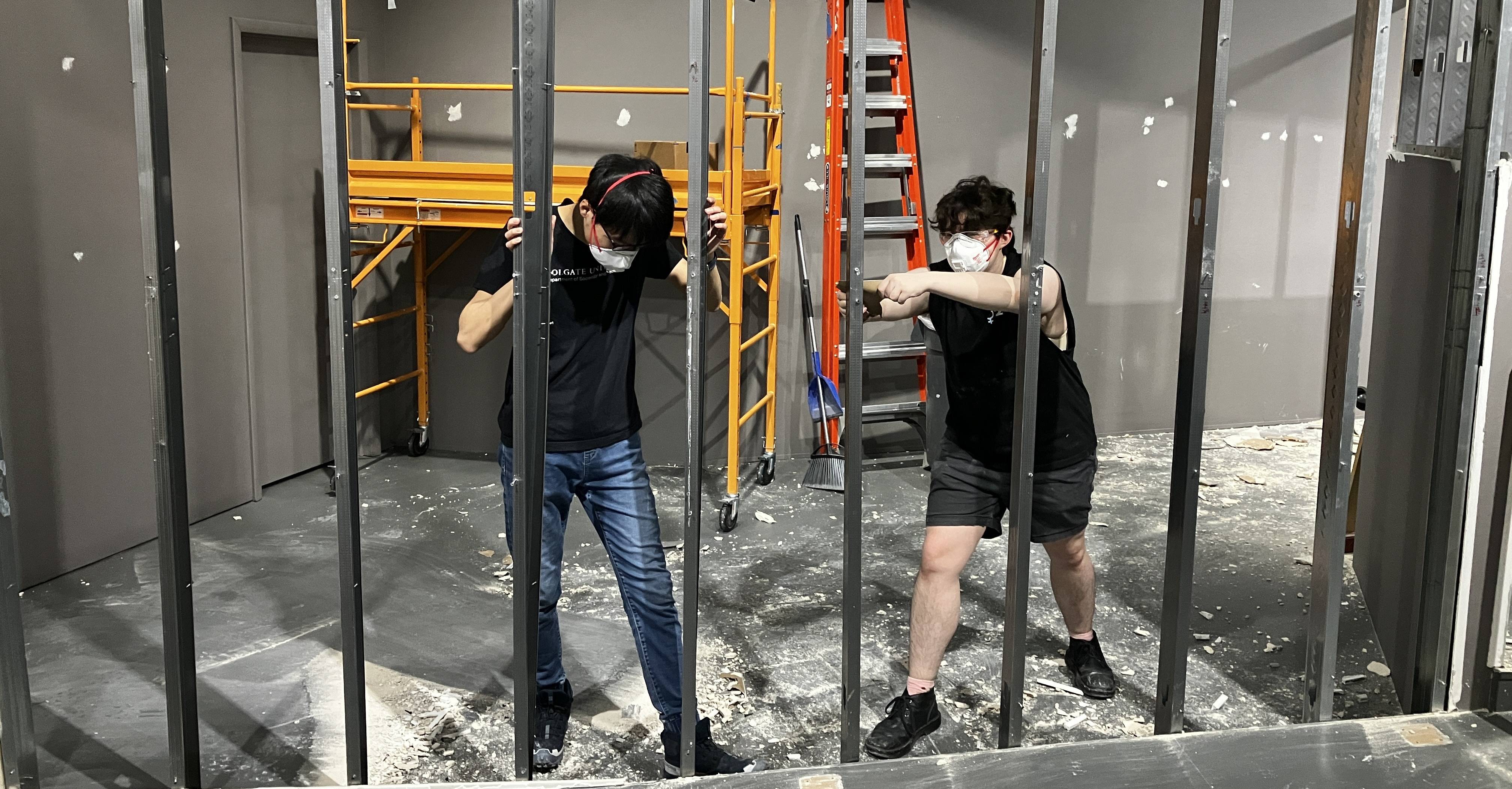 Oscar and a fellow museum employee working on demolition in Picker Art Gallery. 