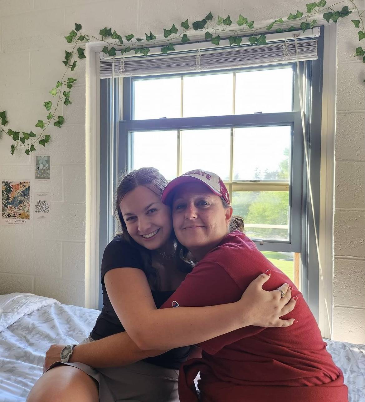 My mom dressed in Colgate gear from head-to-toe moving me into my dorm.