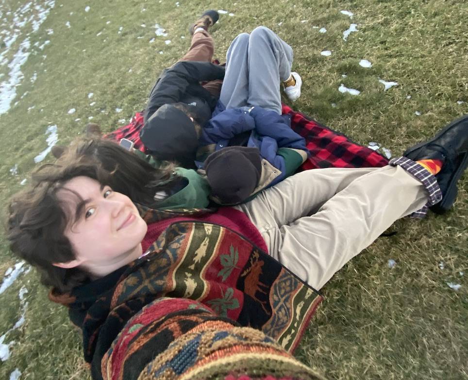 Oscar and friends relaxing at the top of the hill, one of many Colgate’s natural beauties, while watching the sun set.