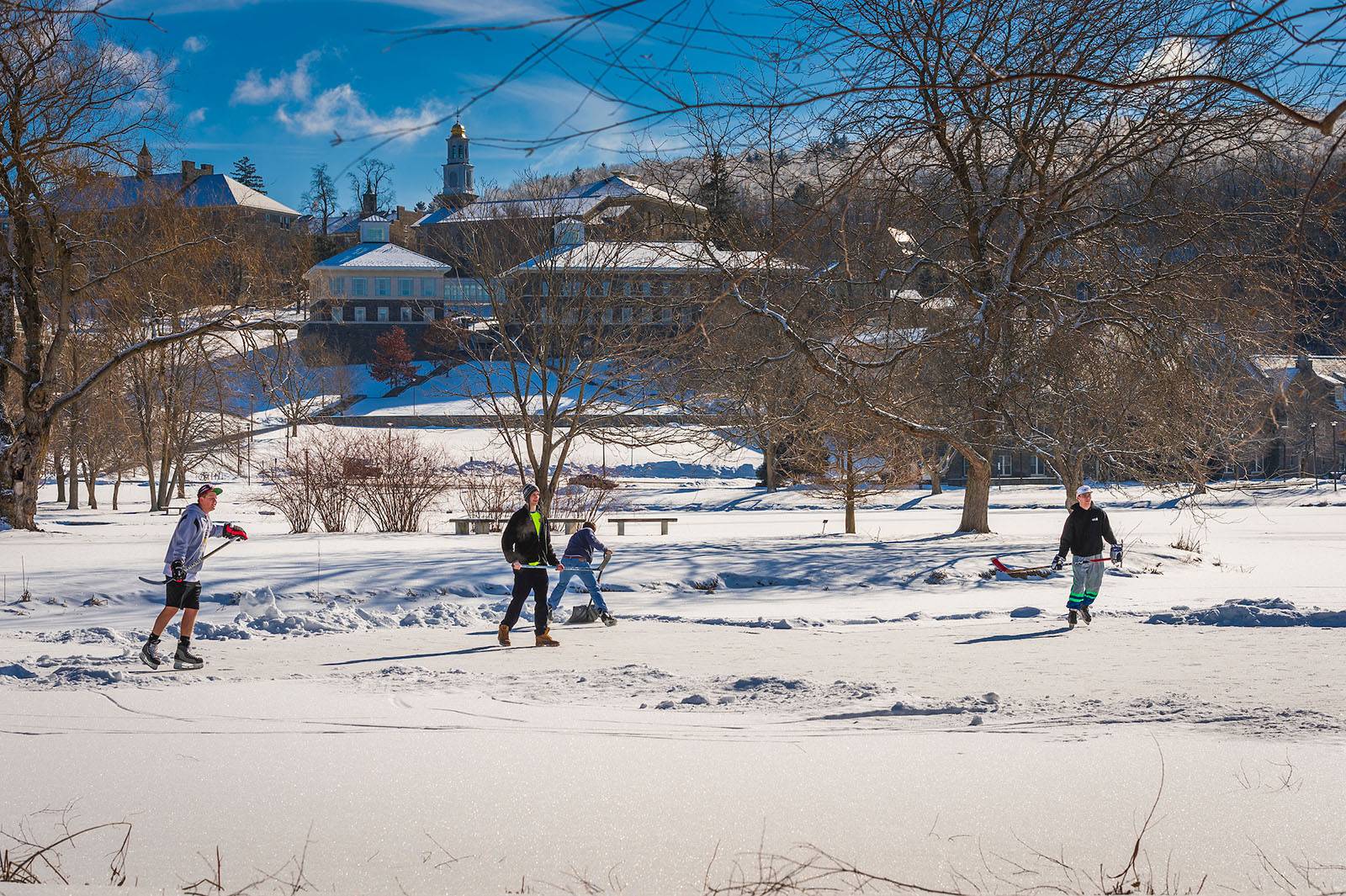 Fraternity brothers play hockey on Taylor Lake