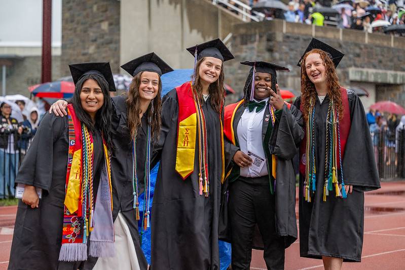 Class of 2025 Colgate University graduates stand outside during the commencement ceremony