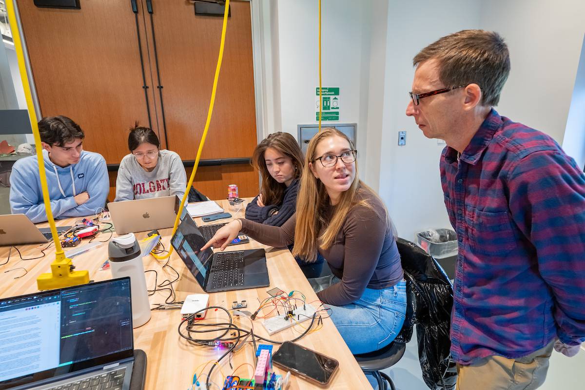 Students in COSC 255 work on lab projects with Professor Joel Sommers
