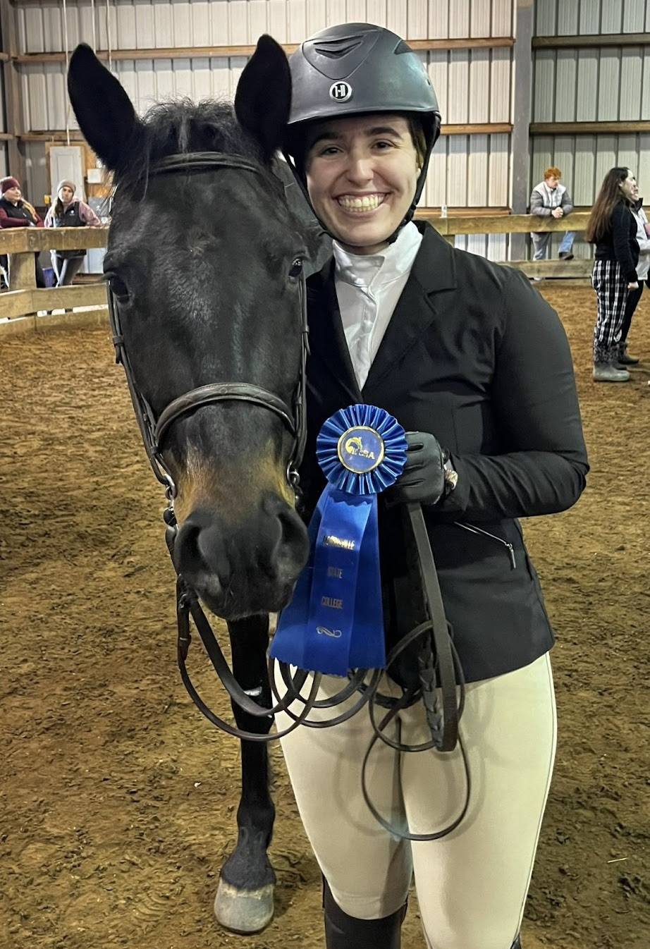 Allie winning first place at a horse show with her favorite horse from Colgate’s equestrian program