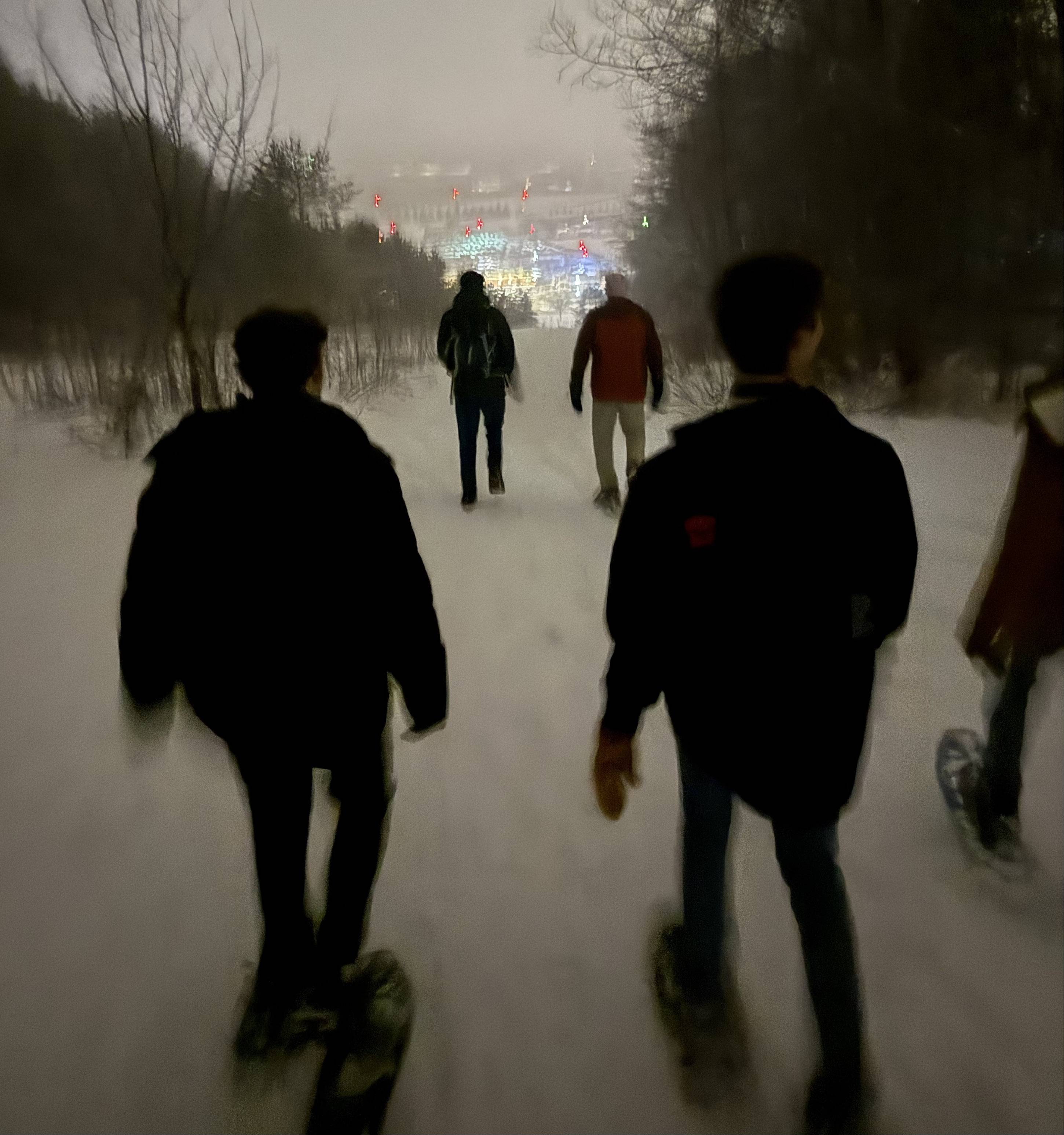 Garrett snowshoeing with his Geography of Happiness class