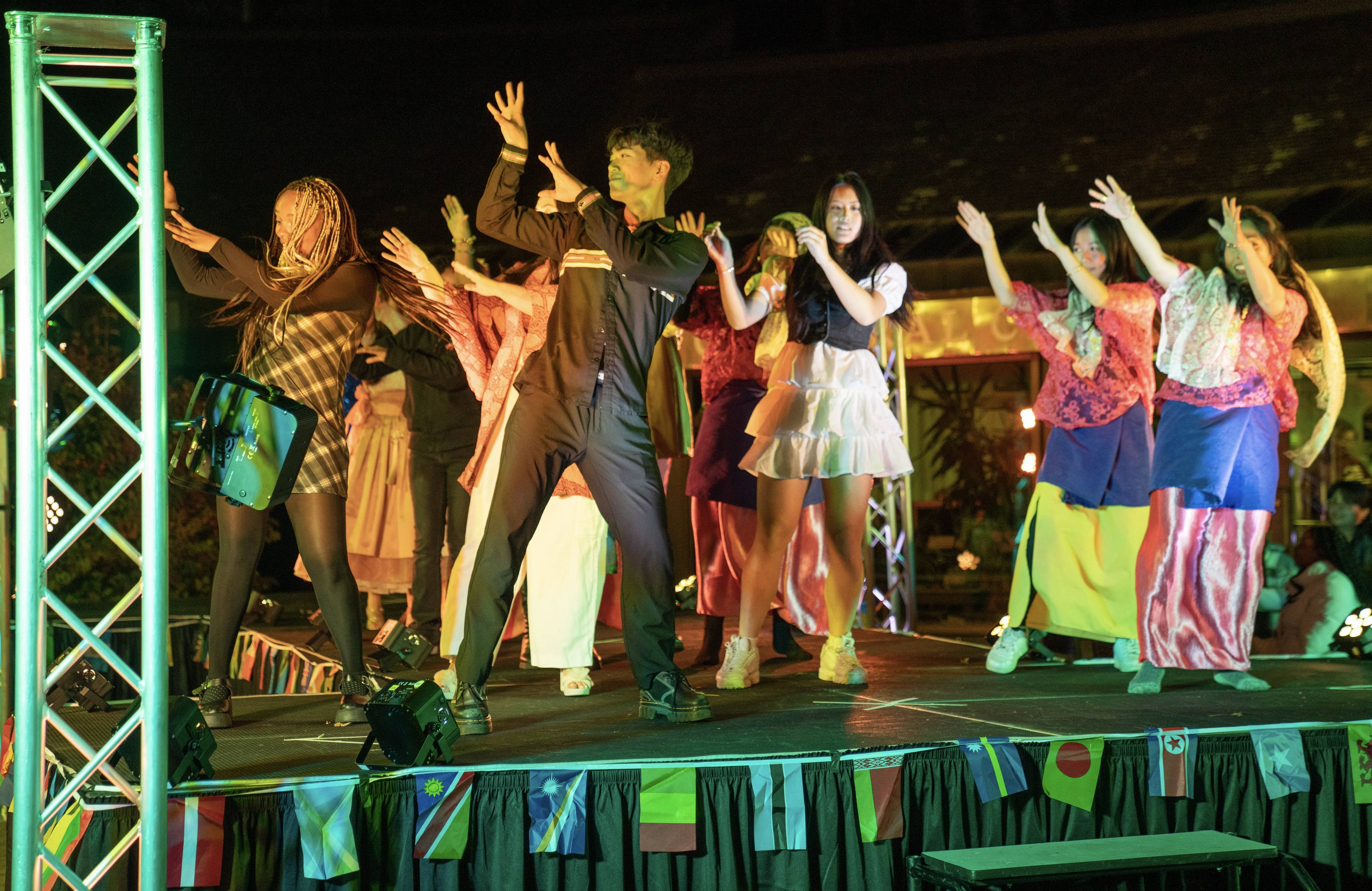 Langh ending the Multicultural Fashion Show with a bang by dancing onstage with fellow participants