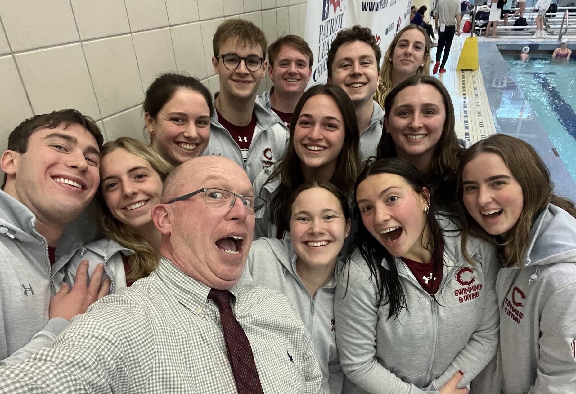 Erin with other seniors on the swim team and head coach Ed Pretre 