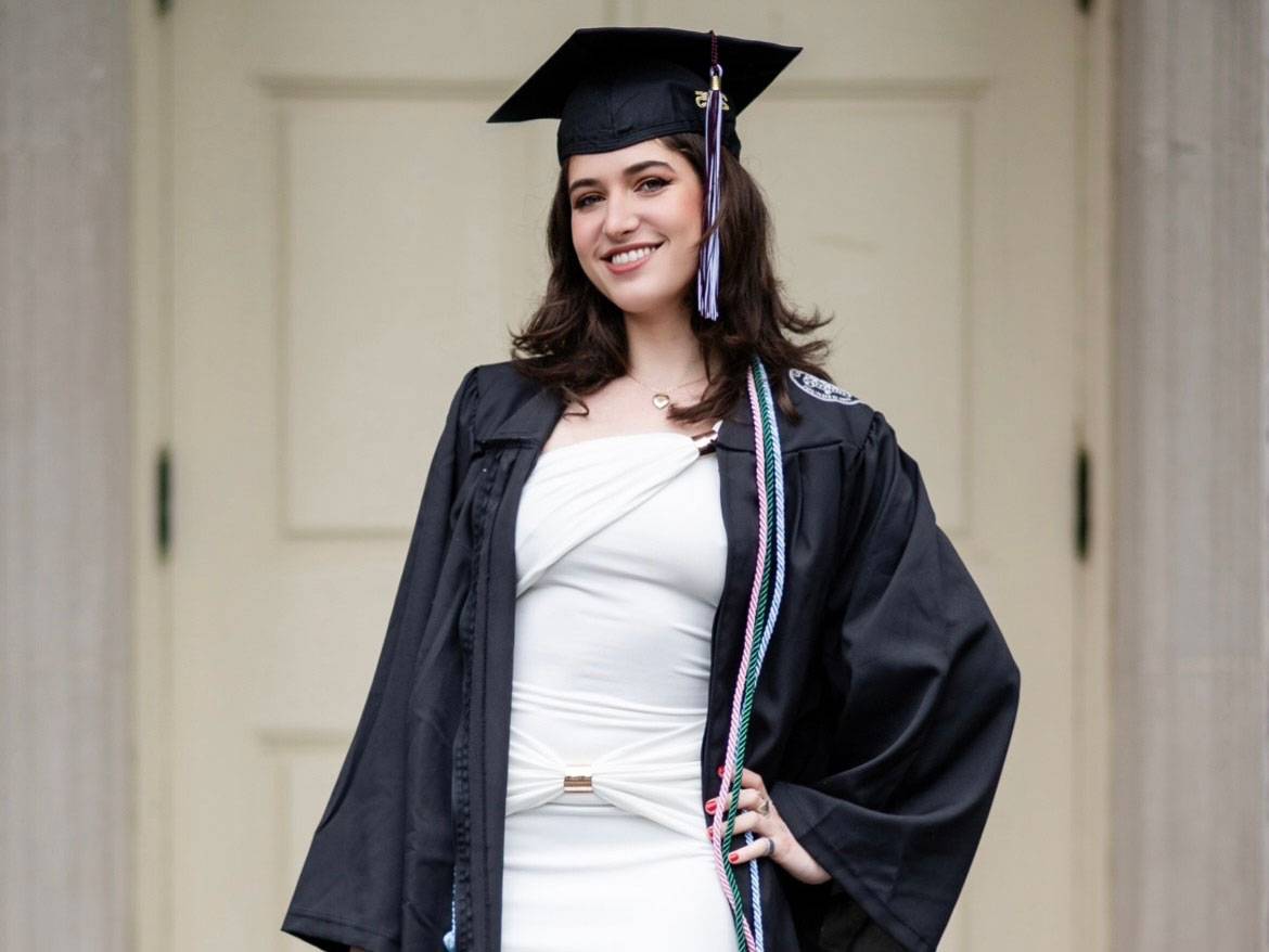 Brook Abeles stands in front of Memorial Chapel
