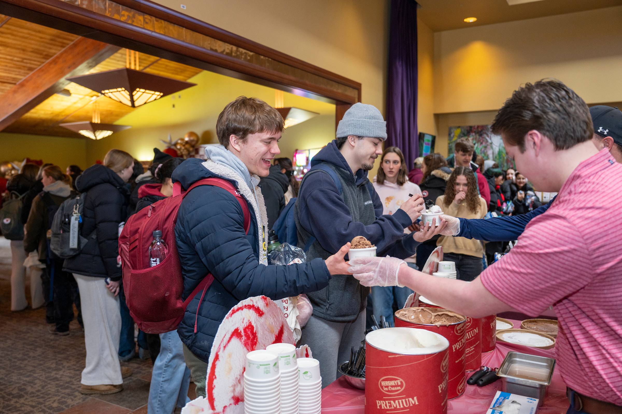Students take free sample from Hershey’s Ice Cream along the line of company representatives (Photo credit: Mark DiOrio)