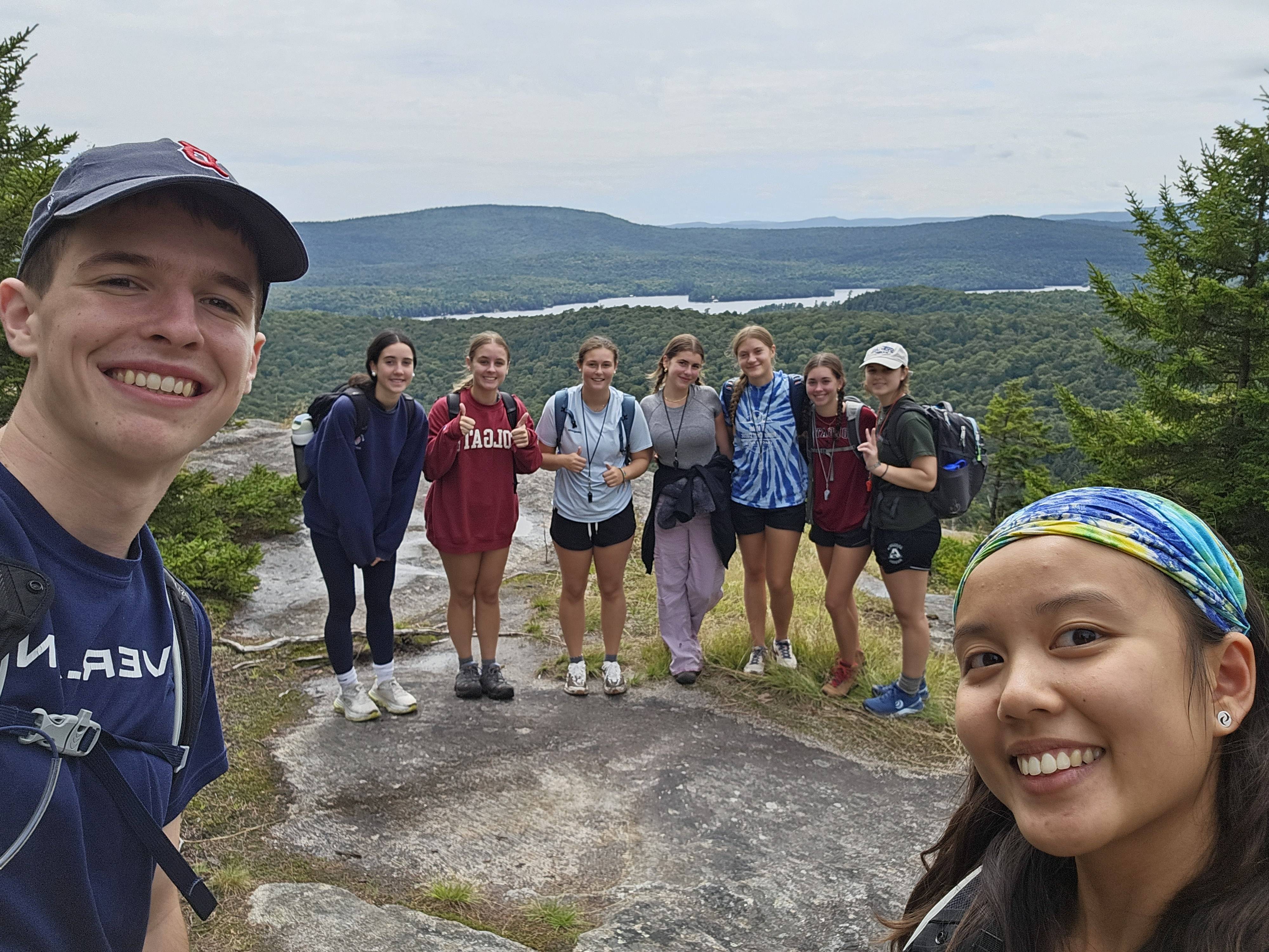 Two OE leaders and a day hike group on a mountain summit