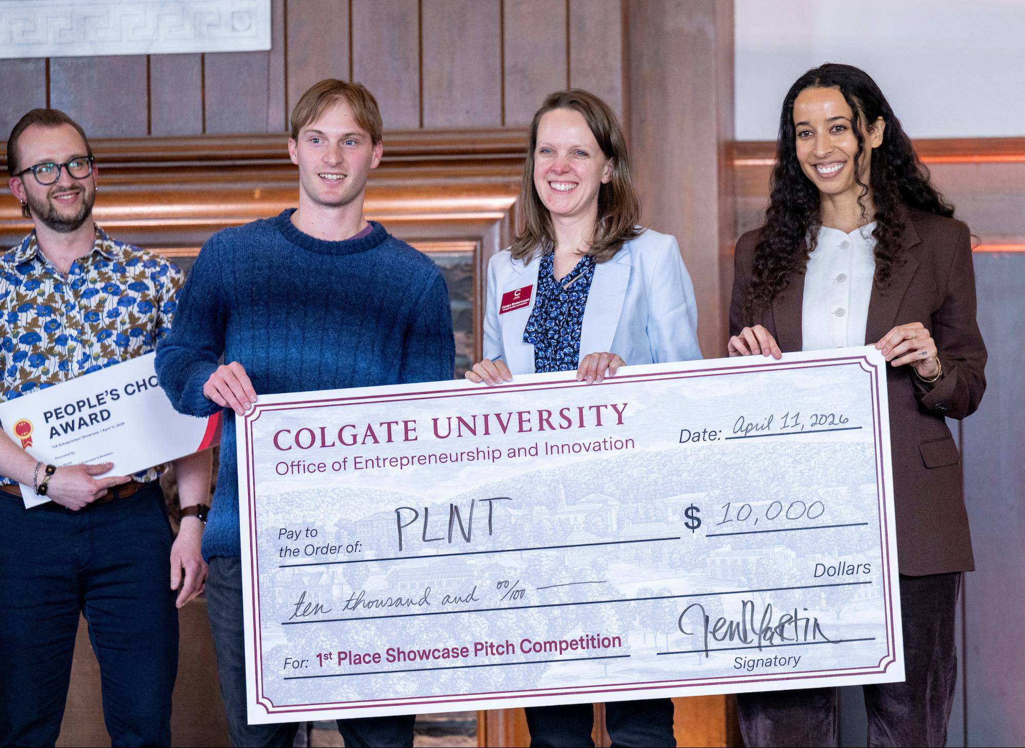 Porter Comstock ’26 receiving grand prize with Carolyn Strobel-Larsen and Jen Martin