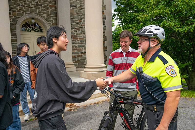 A Campus Safety officer speaks with a student