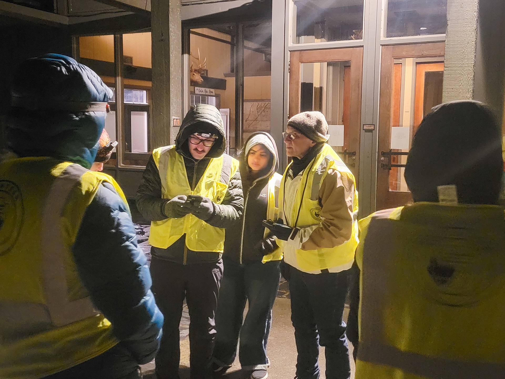 Professors Bary (right) and Loranty (left) with Roshan Abdelghaffar ’28 (middle) recording data on smartphones. 