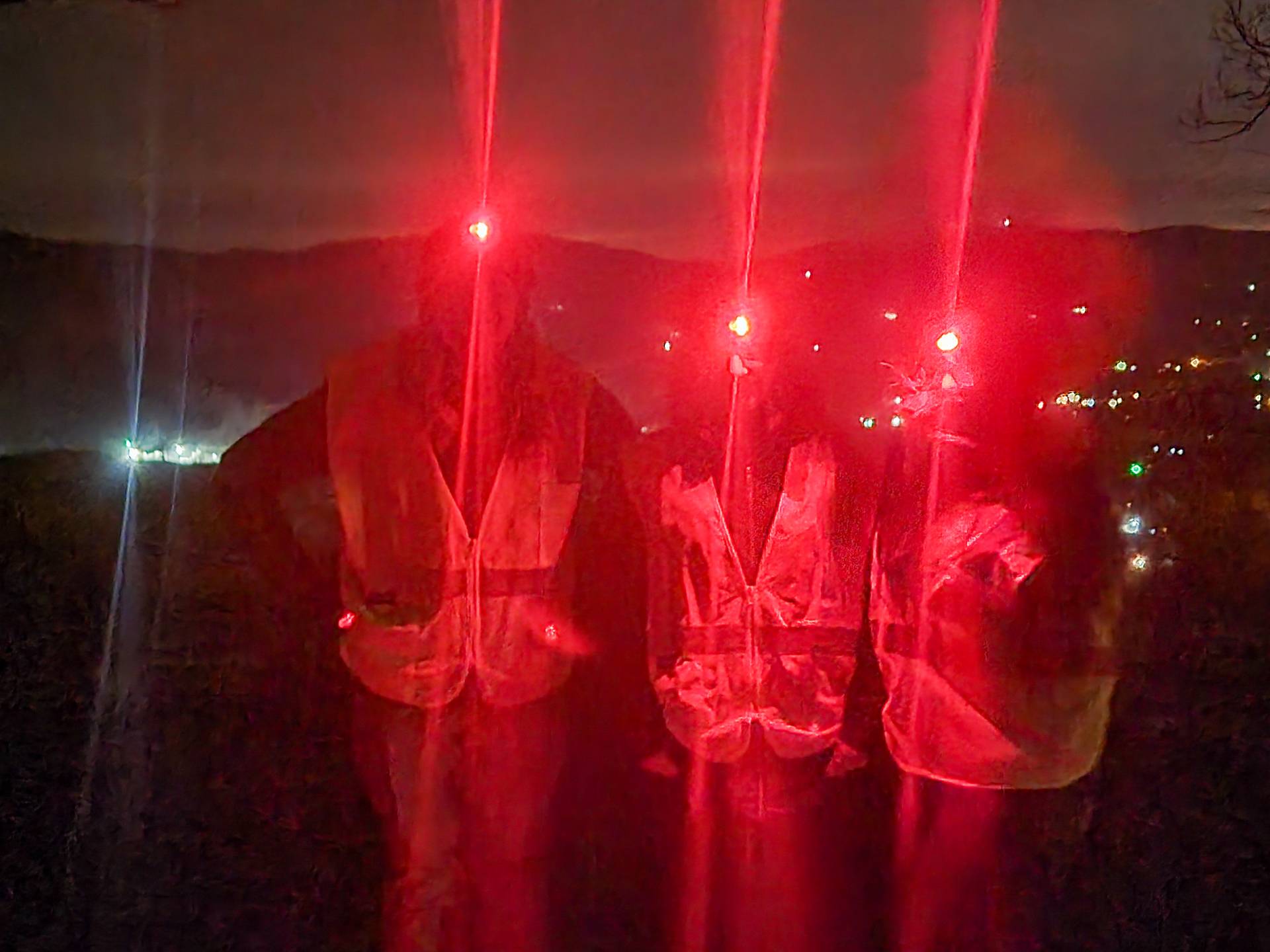 Dark Sky survey crew members showing off their official National Park Service reflective vest and red head lamps 