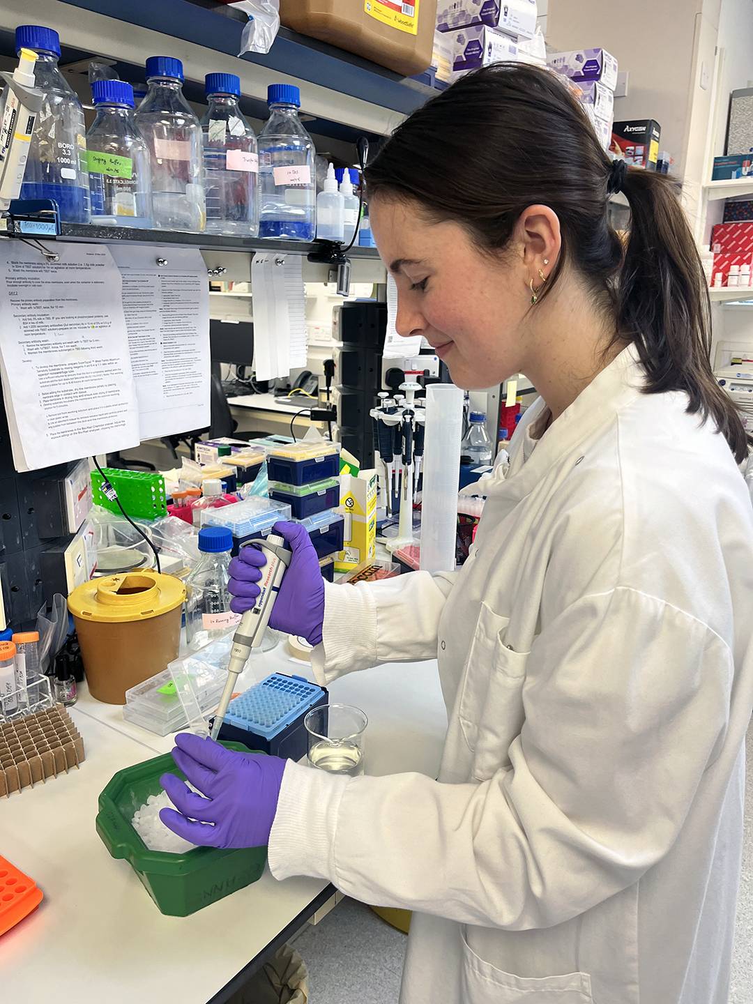 Johnson performing research in the lab