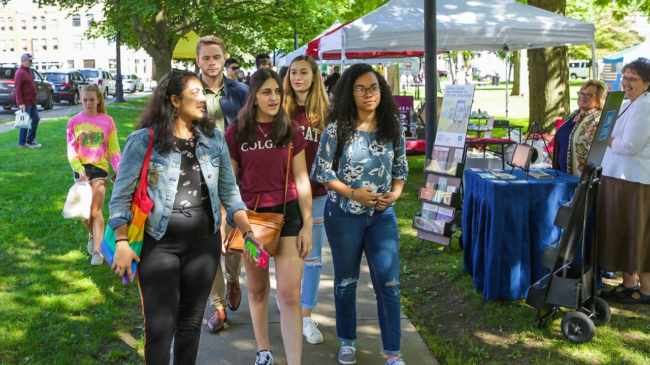 Students walk along the village green