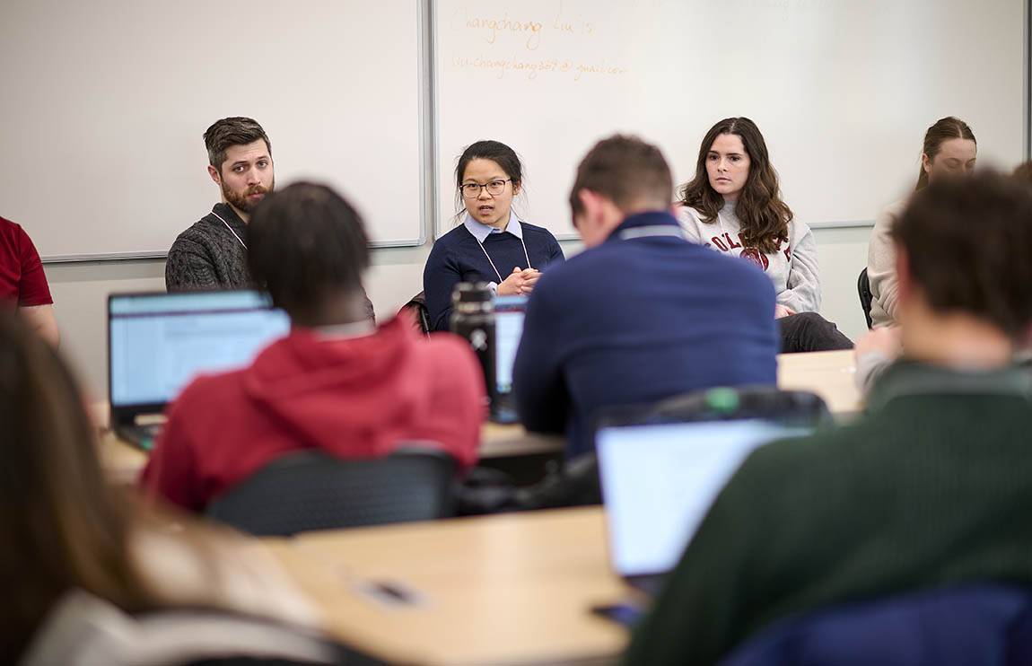 Students listen to alumni presenters