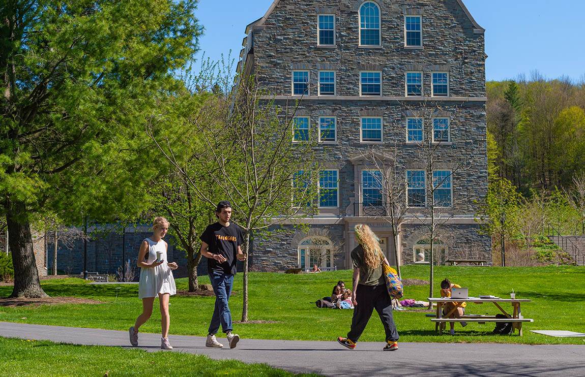 Students walk through the residential quad during spring