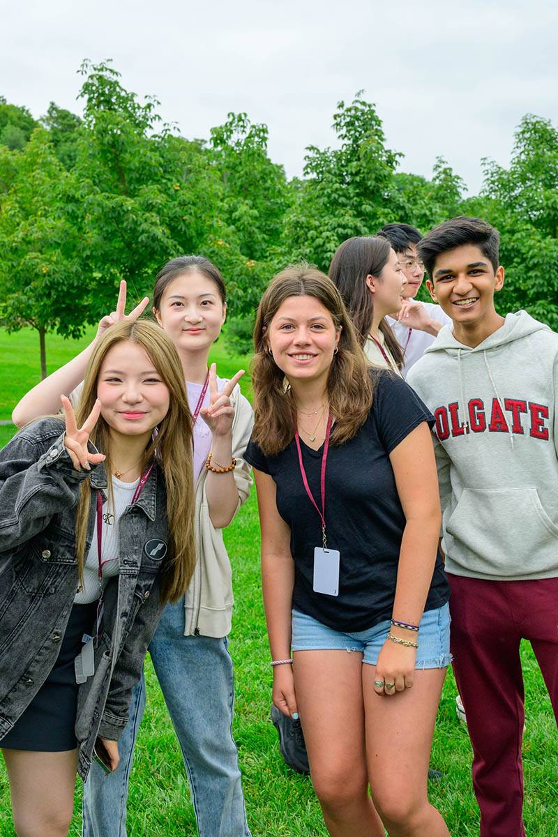 A group of five students pose for a photo