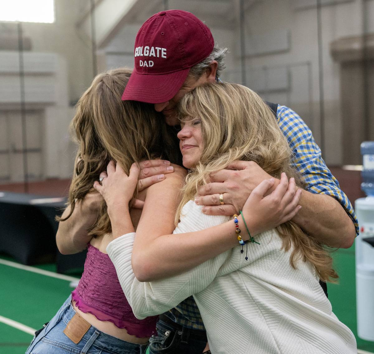 Colgate Dad hugs daughter during family embrace