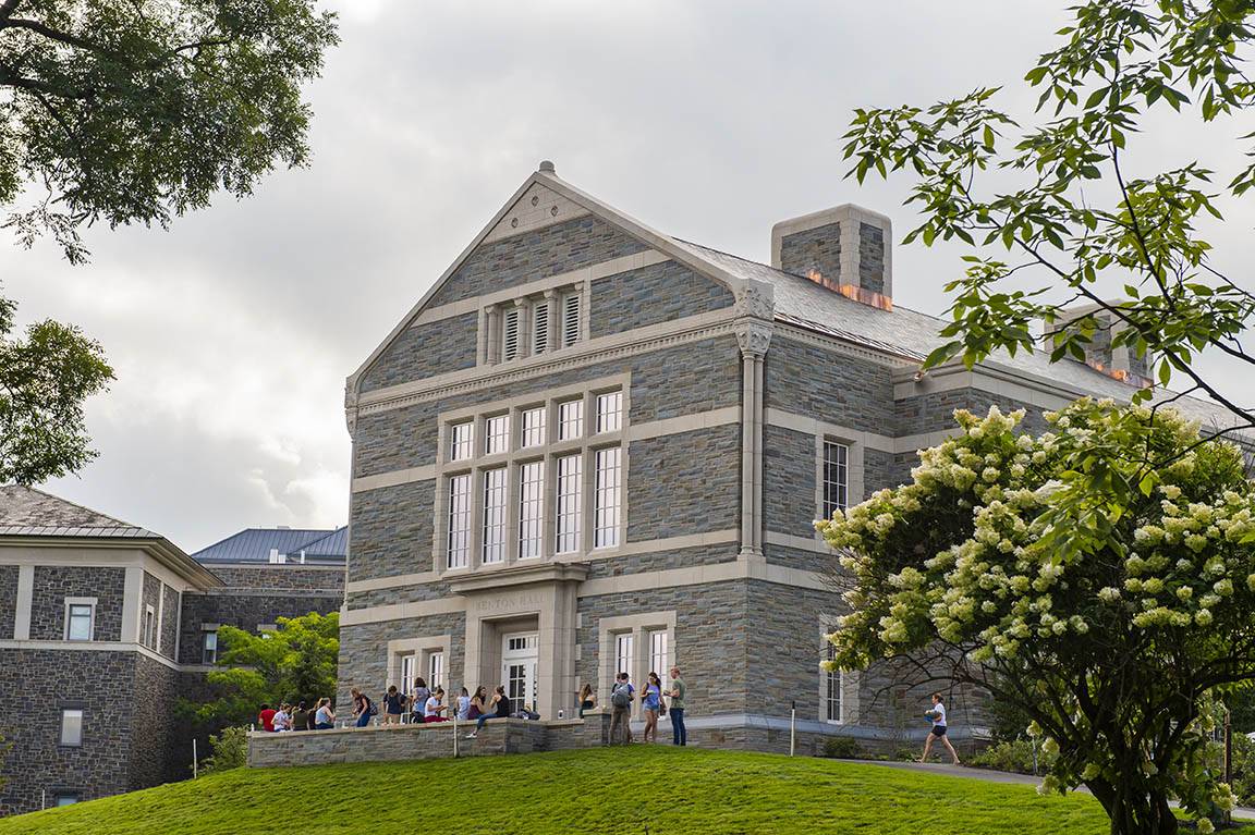 Students gather outside of Benton Hall