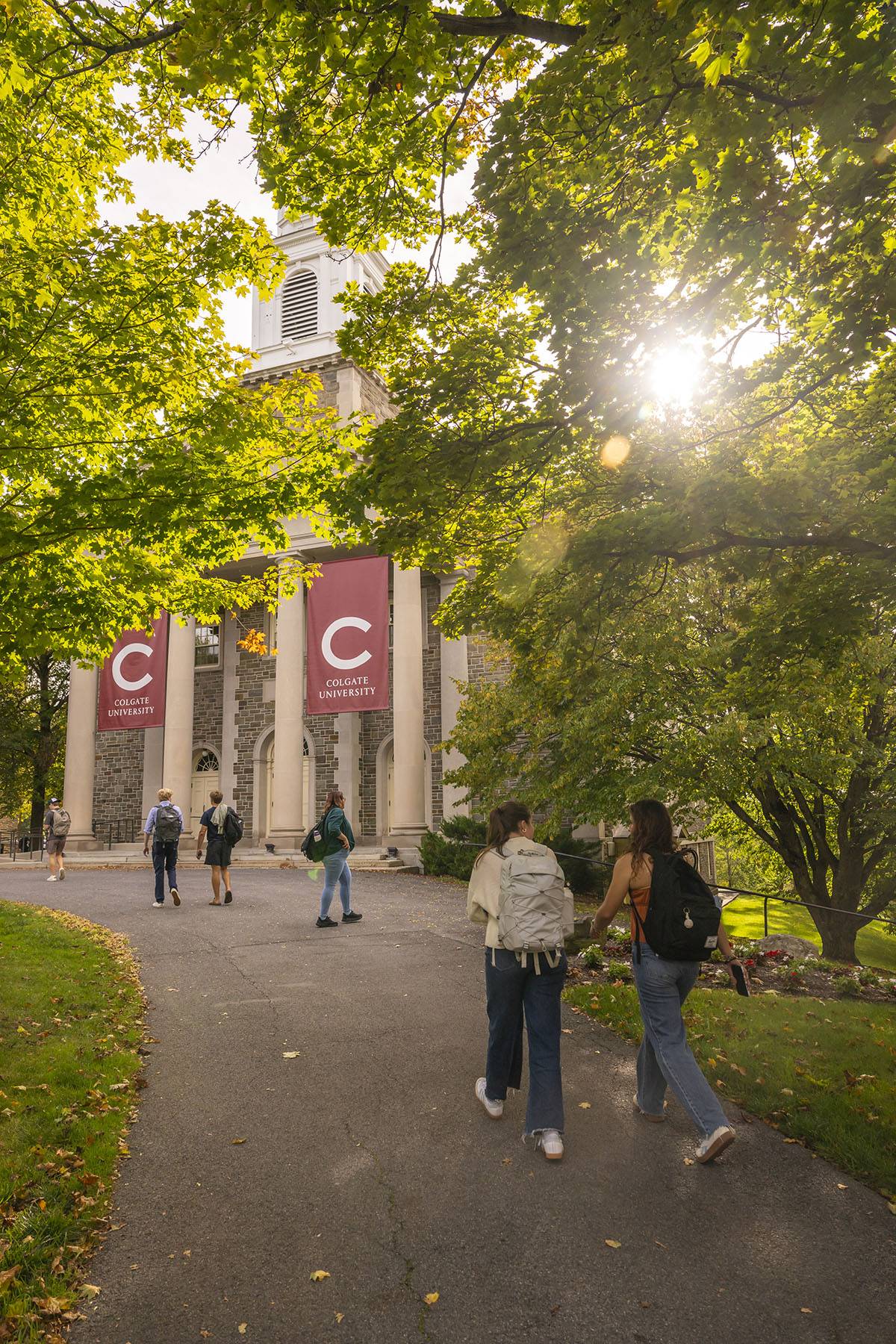 Students walk past the Memorial Chapel on a sunny fall day