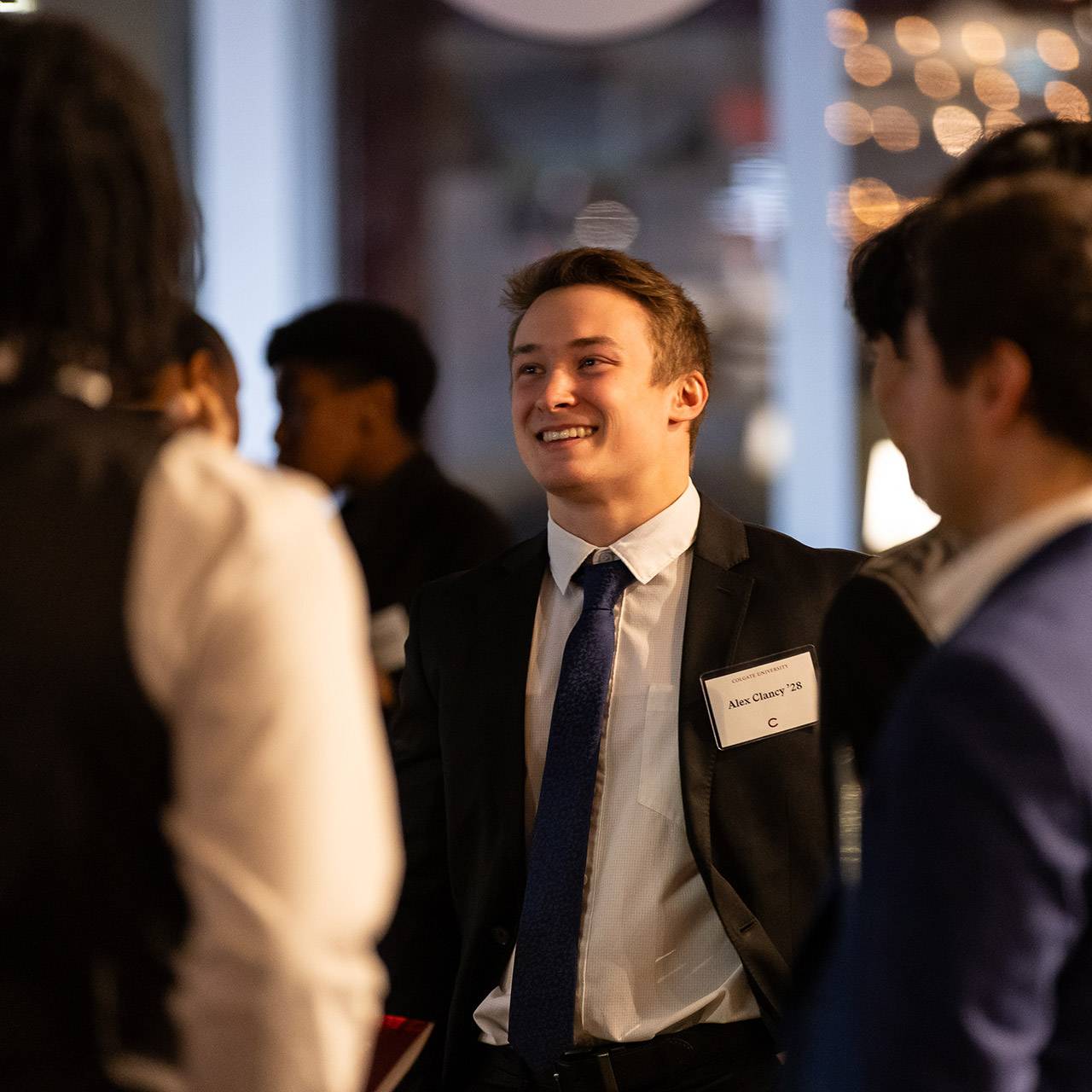 Students and alumni at an event
