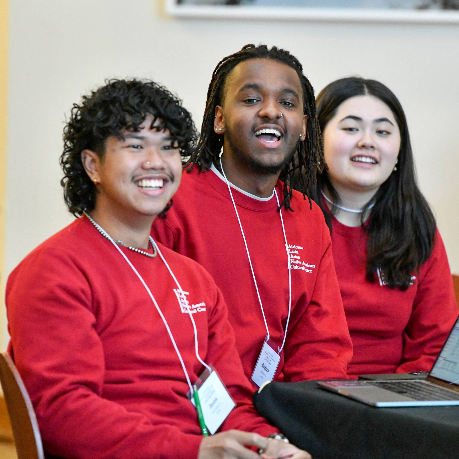 Students wearing matching red sweatshirts.