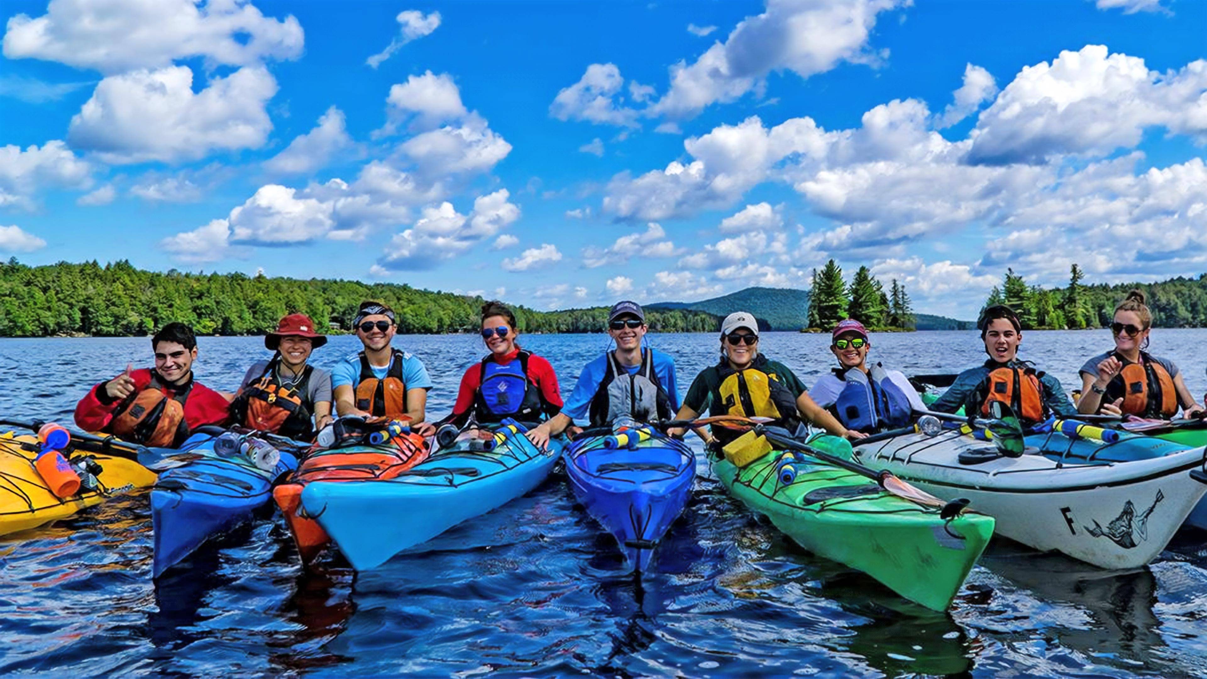 Students in kayaks on lake