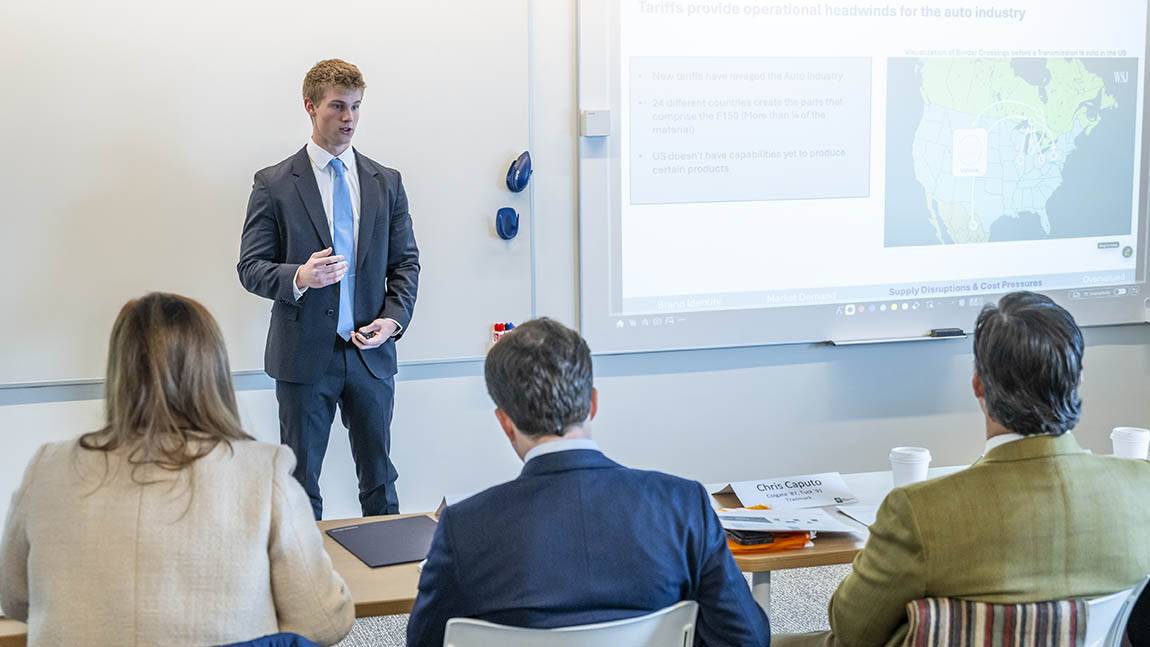 A student presents his capstone presentation