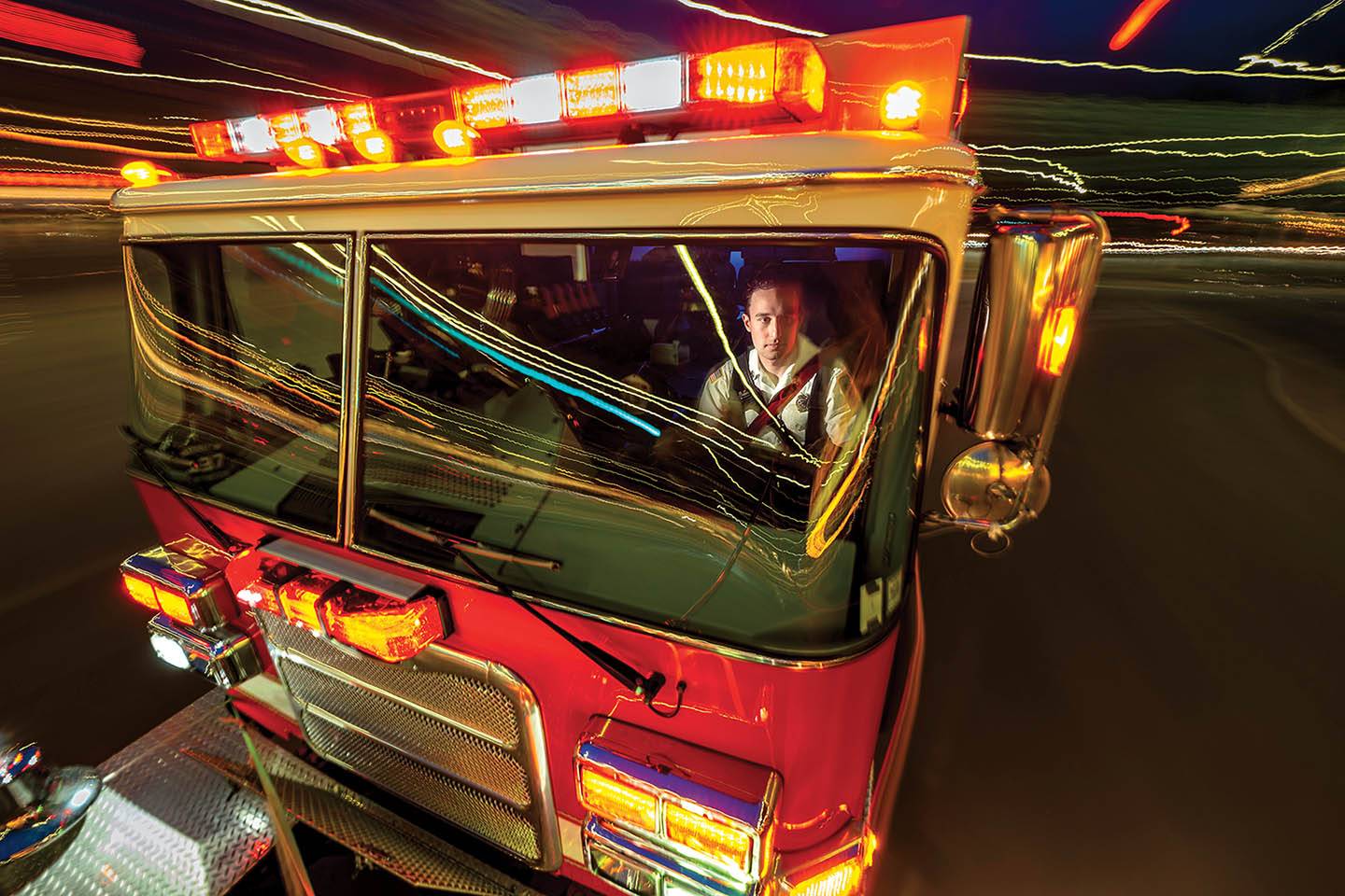 Will Vagianelis sits in a fire truck